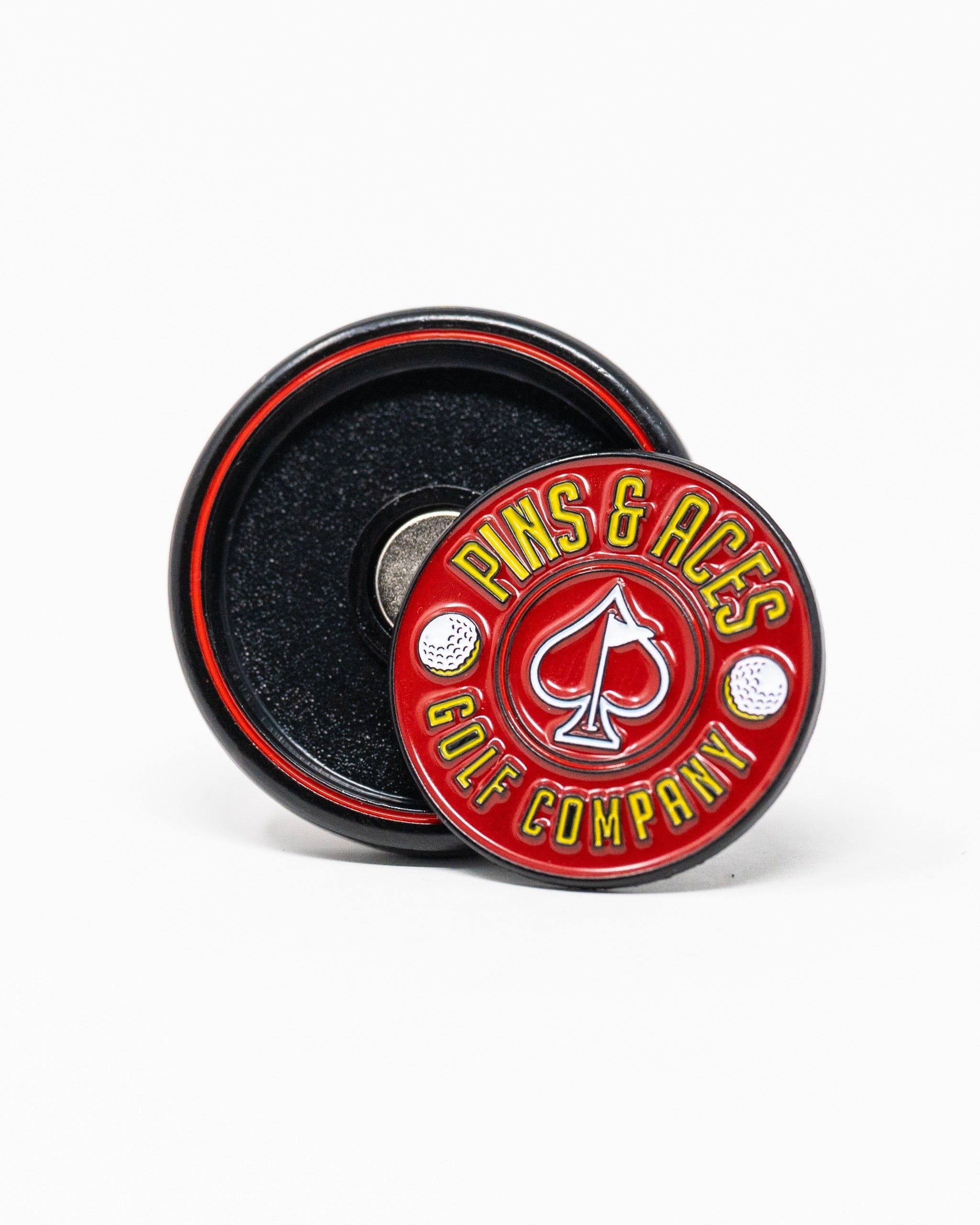 Red Pop Out Medallion Ball Marker featuring the Pins and Aces logo, designed for stylish golf enthusiasts.