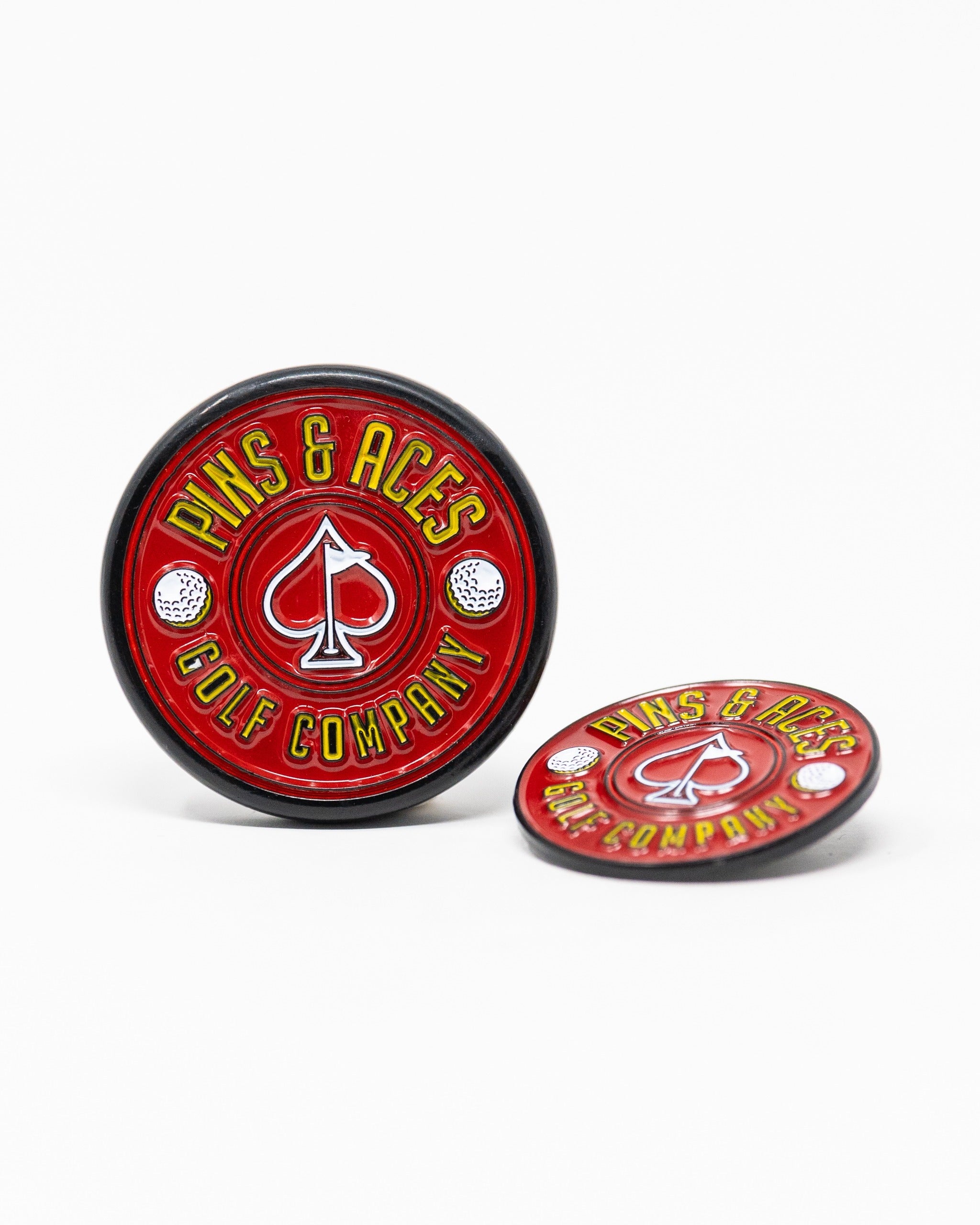 Red Pop Out Medallion Ball Marker featuring a spade logo and golf elements, ideal for stylish golfers on the course.