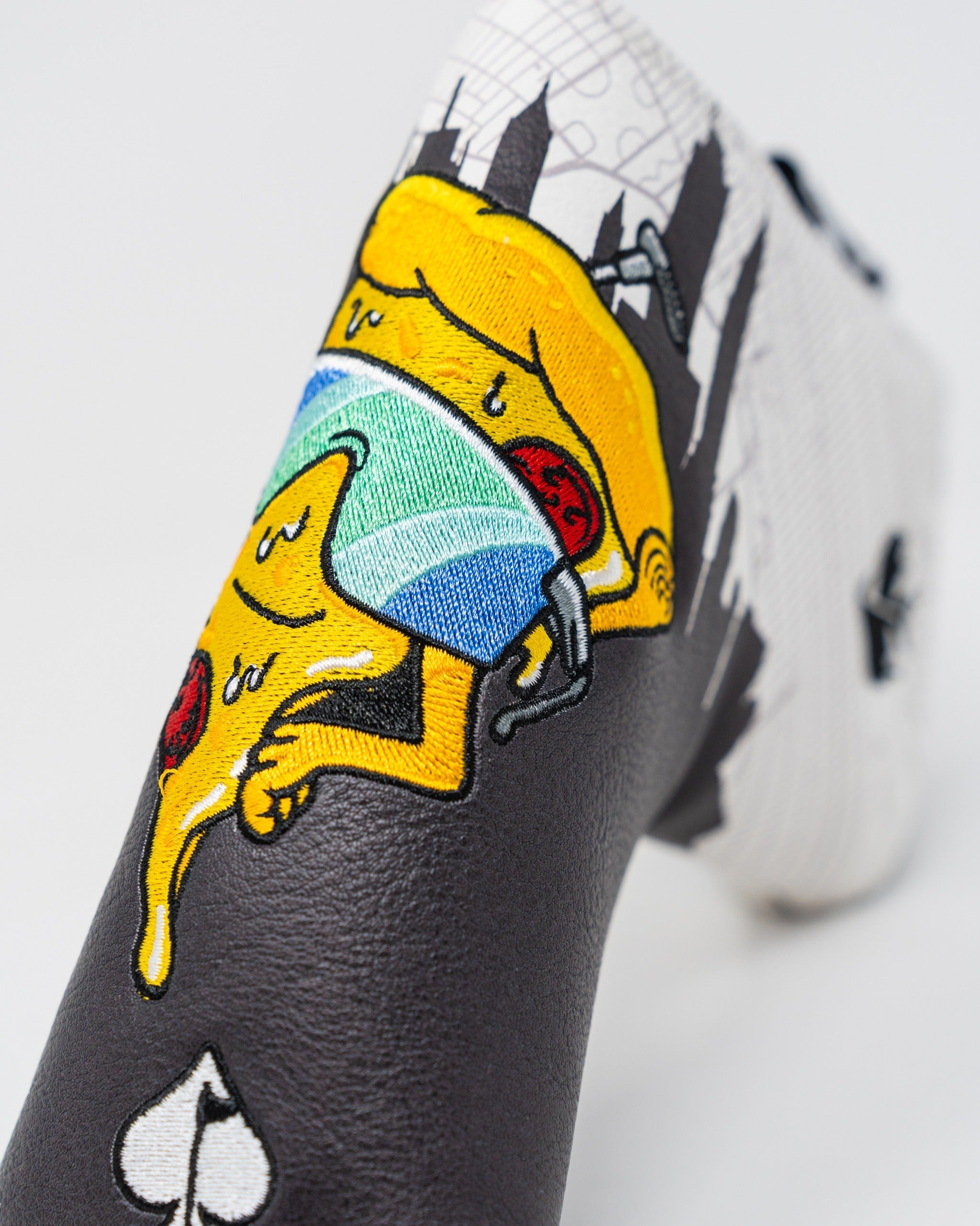 Bold Shady Slice Blade Putter Cover featuring a playful pizza design with vibrant colors and unique detailing.