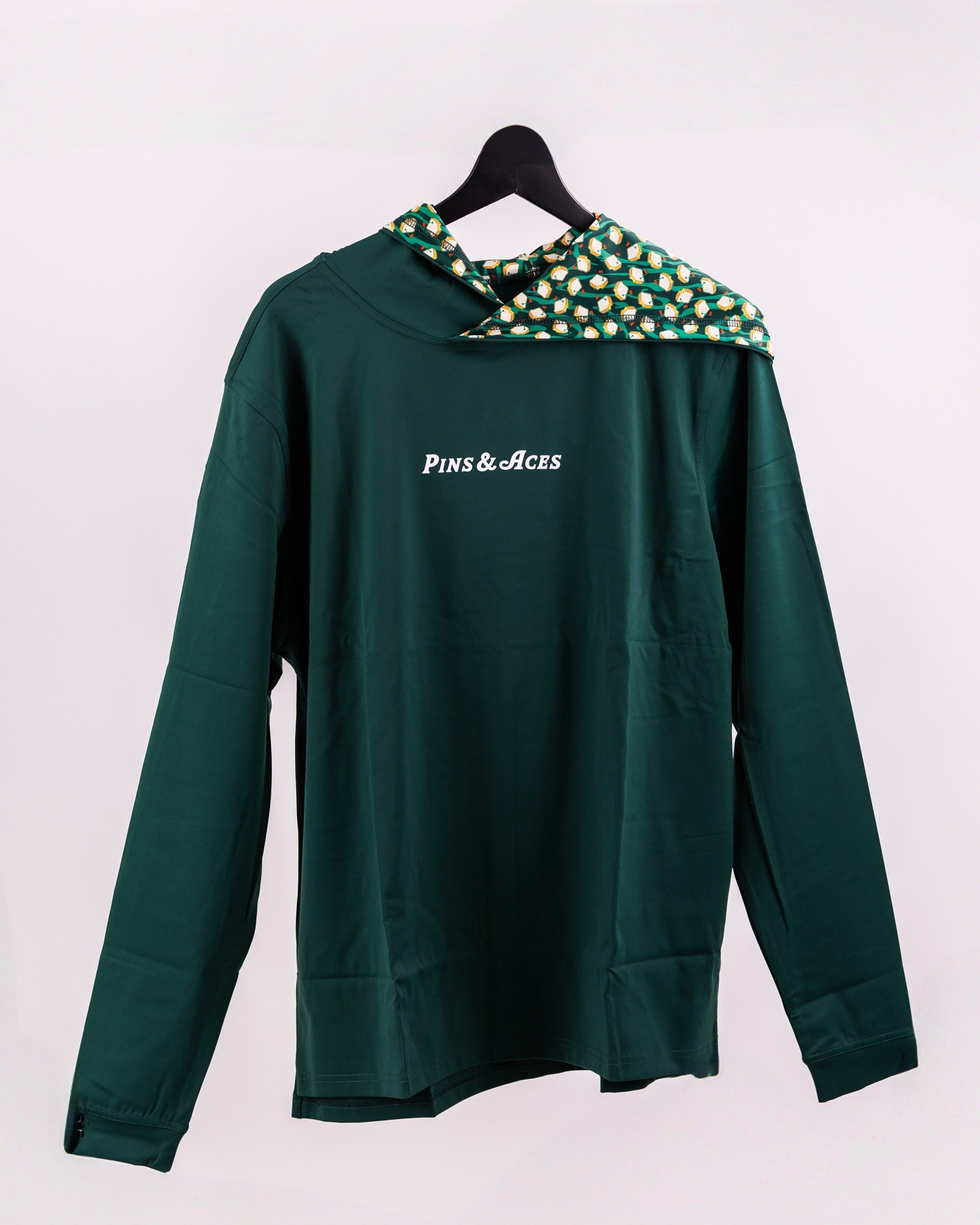 Performance Golf Hoodie in Pimento 4.0, featuring a stylish green design and unique patterned hood, ideal for golfers.