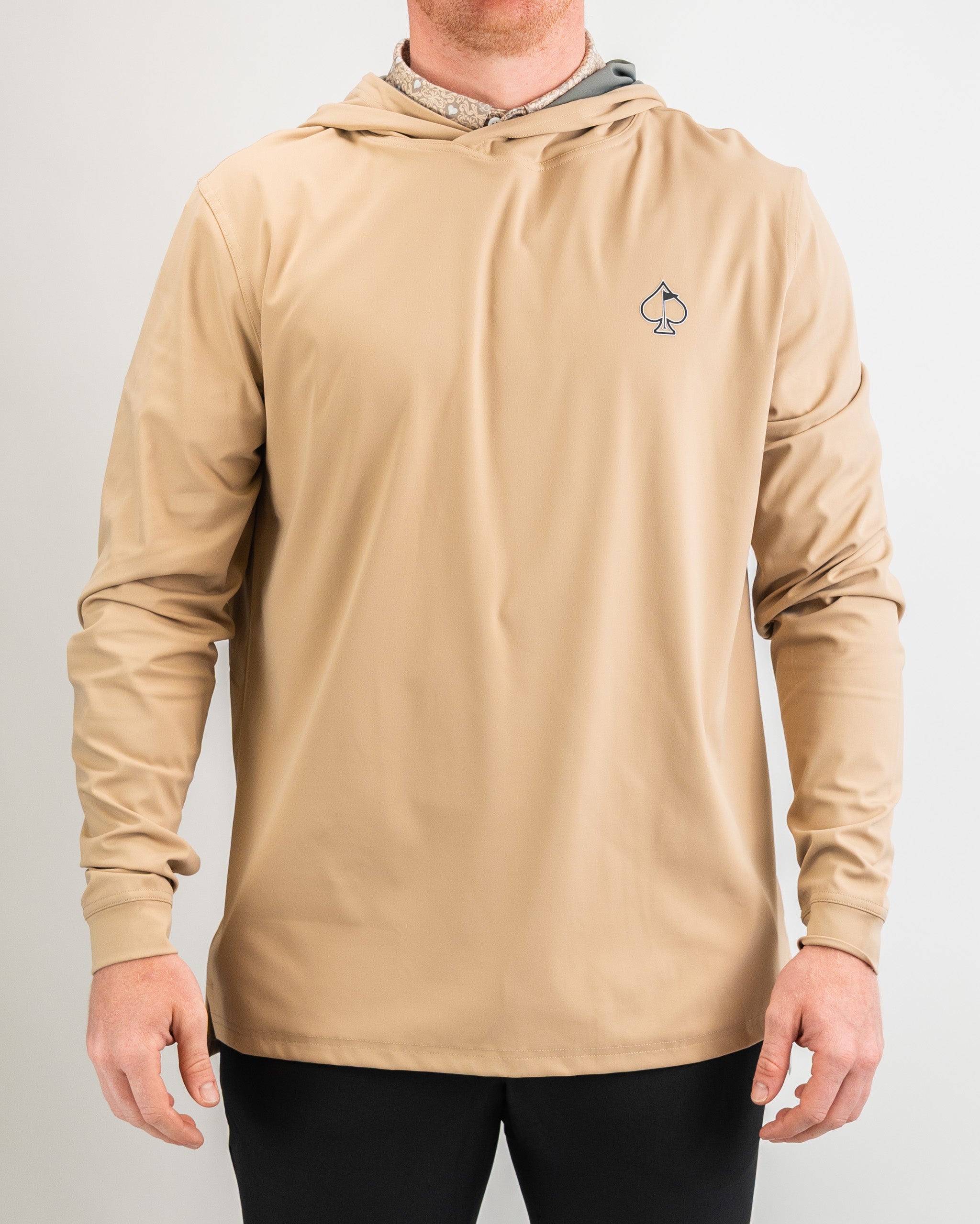Men's performance golf hoodie in sand color, featuring a lightweight design and spade logo for stylish on-course comfort.