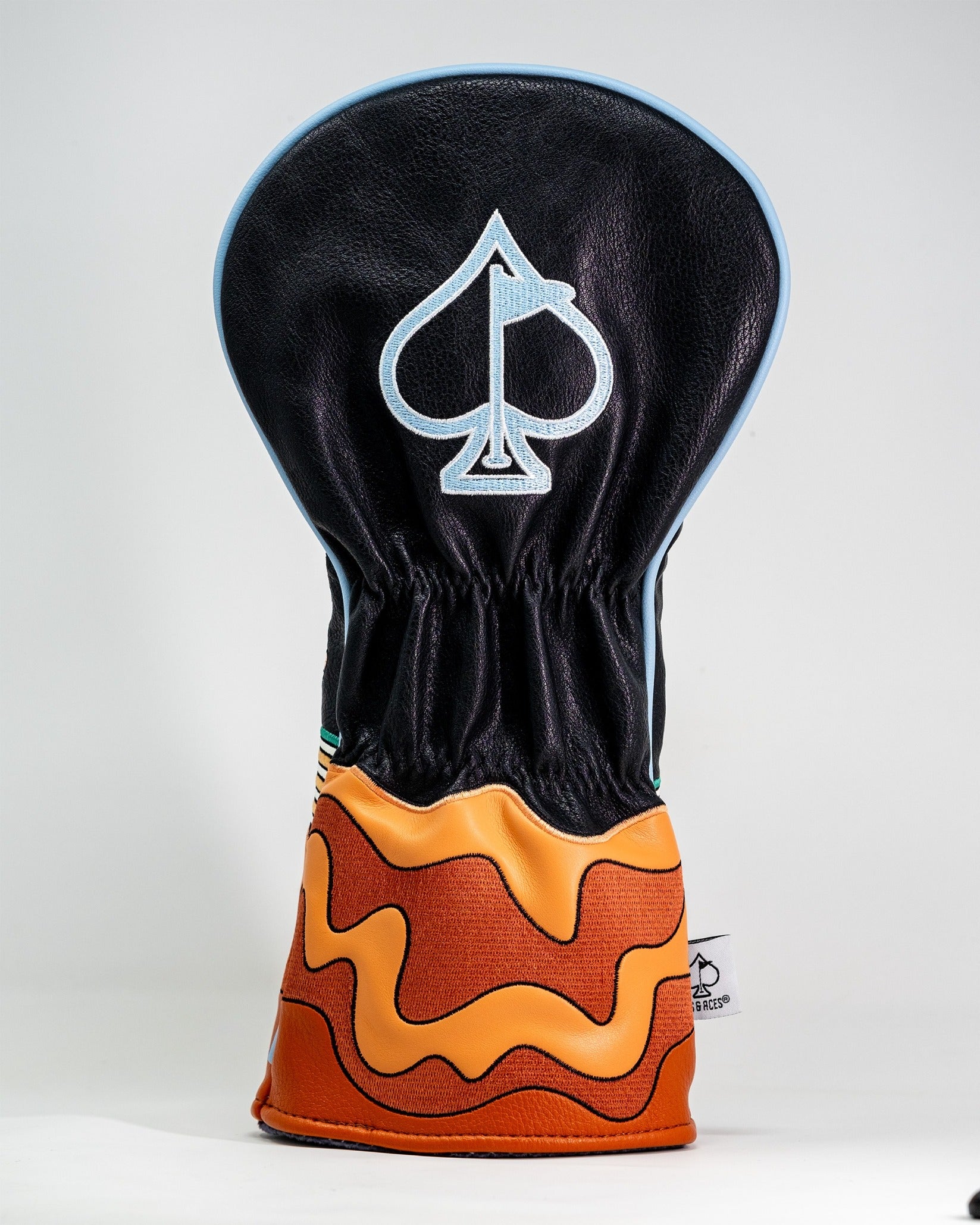 Bold driver cover designed to resemble ramen, featuring a black top with an ace of spades logo and colorful noodle details.