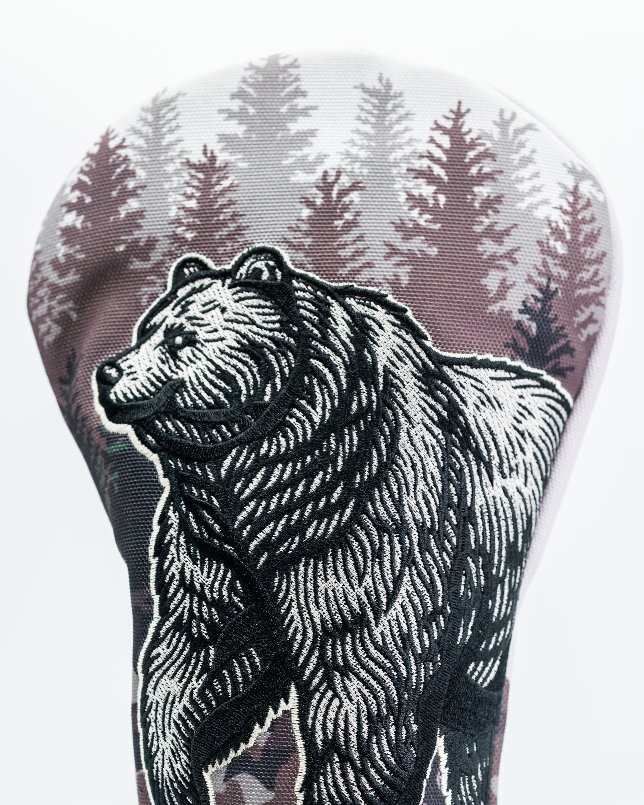 Bold bear driver cover featuring intricate embroidery and a forest backdrop, perfect for golfers wanting to stand out.