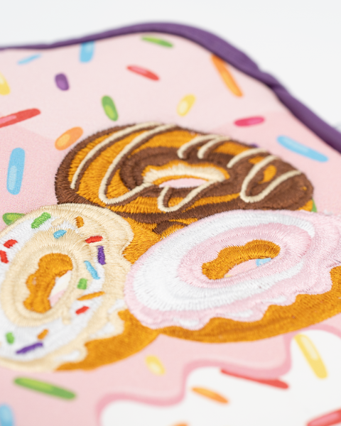 Colorful mallet putter cover featuring embroidered donuts with sprinkles on a pink background, perfect for stylish golfers.