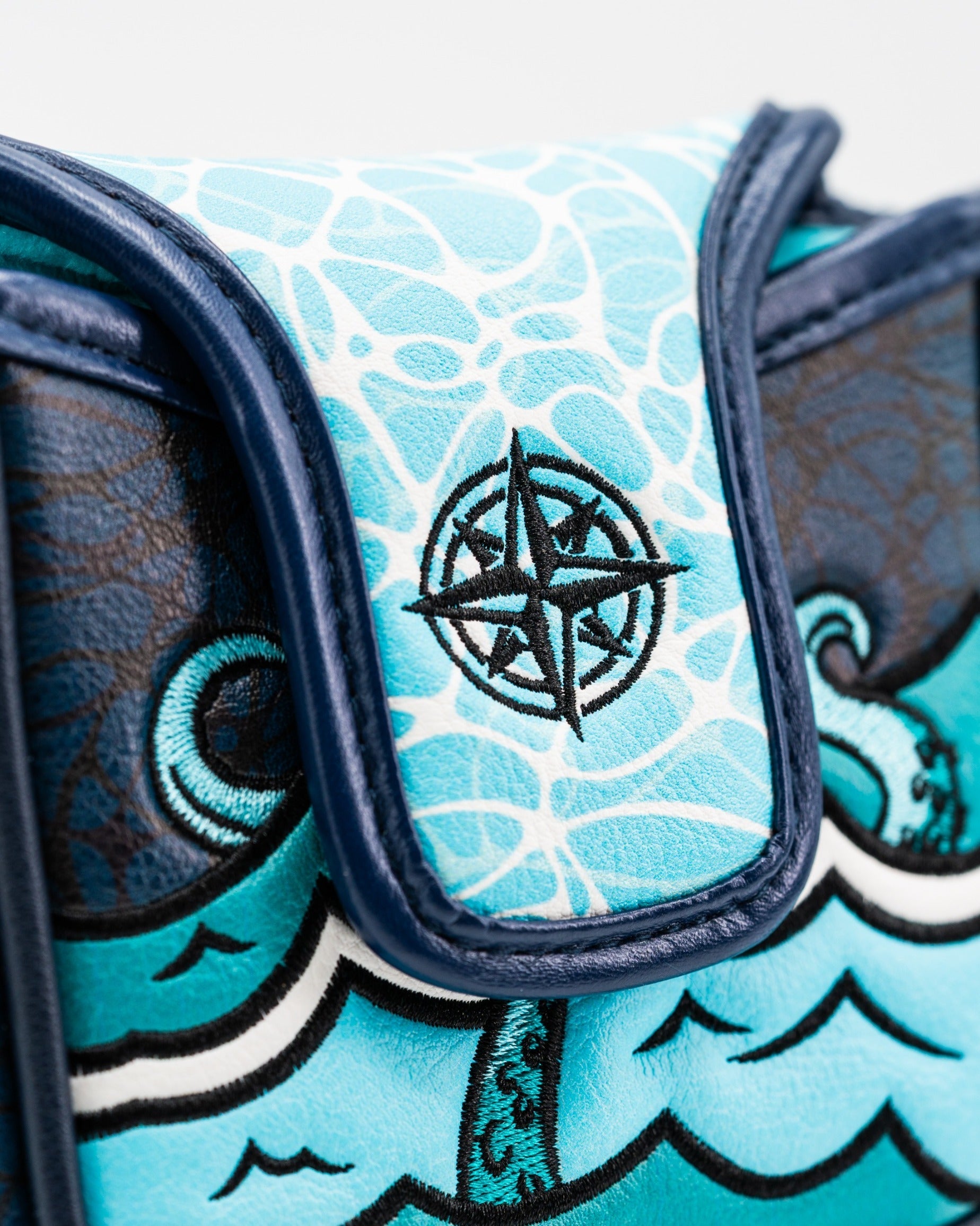 Bold Kraken mallet putter cover featuring vibrant blue design and compass emblem, perfect for stylish golfers.