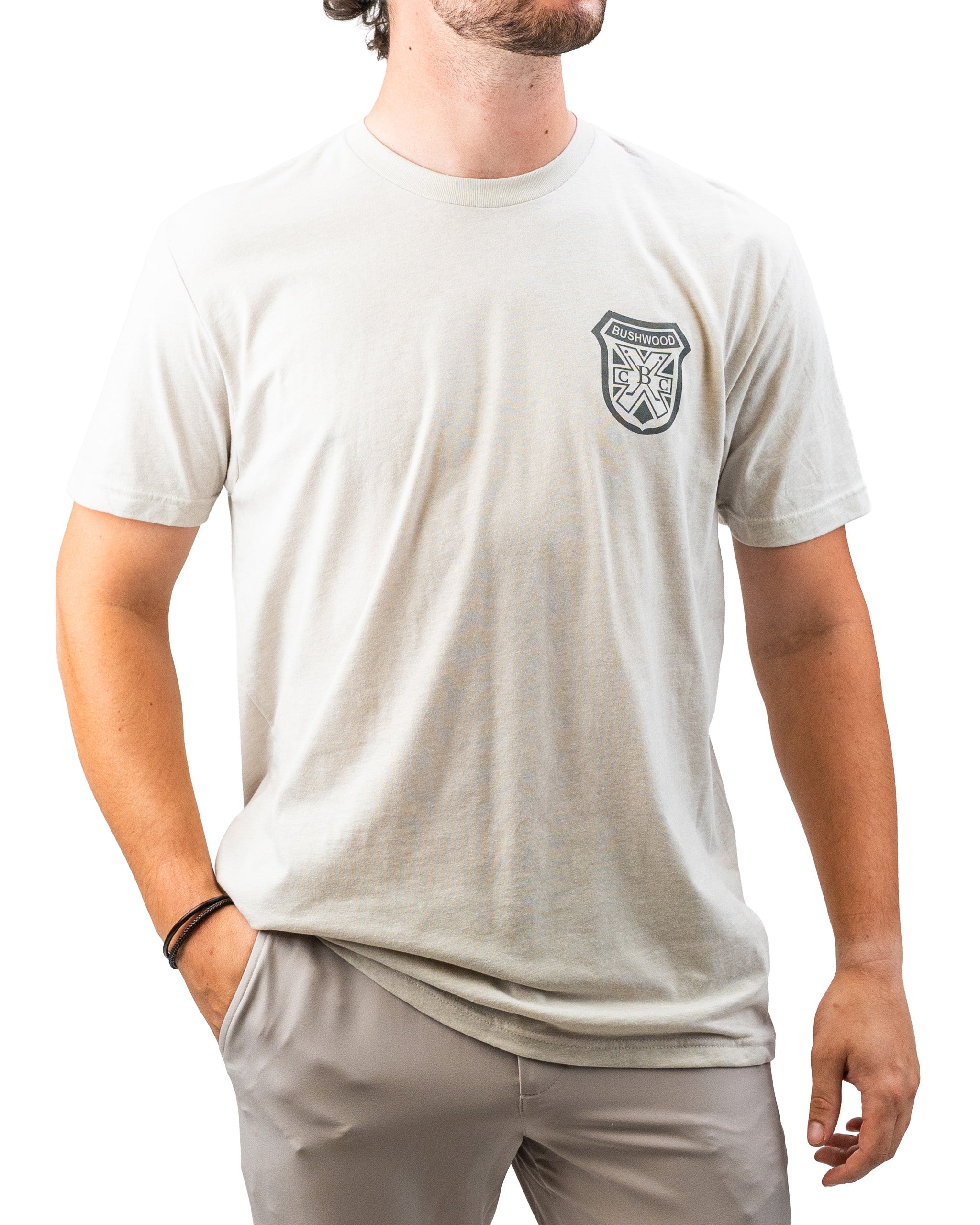Men's light gray Bushwood Crest 3.0 tee shirt featuring a logo on the left chest, perfect for stylish golf outings.