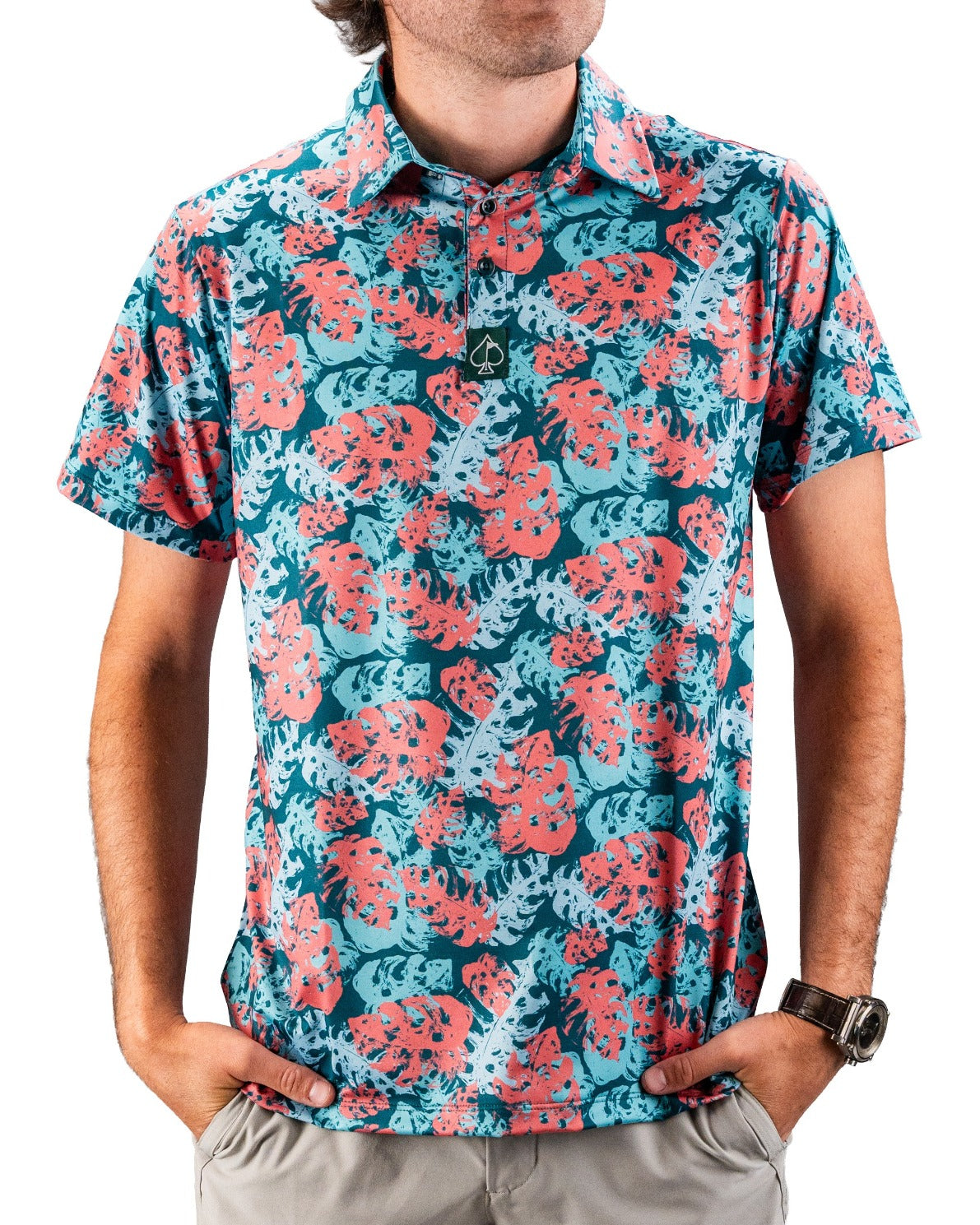 Bright blue and coral tropical leaf print golf shirt with short sleeves, casual fit, and collar, perfect for bold course s...