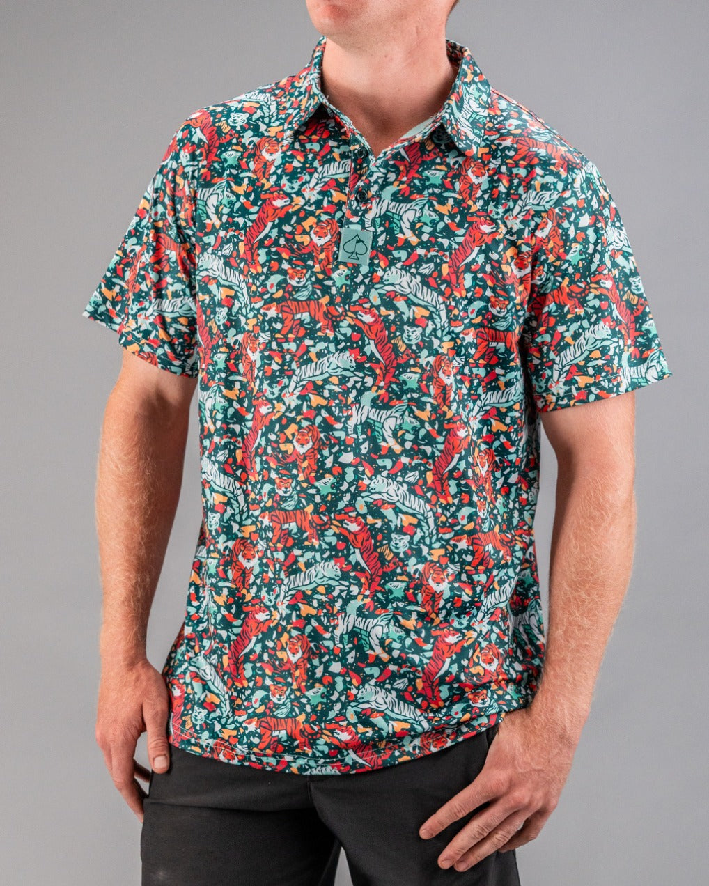 Bold teal golf shirt featuring a vibrant tiger and floral pattern, perfect for golfers looking to make a statement on the course.