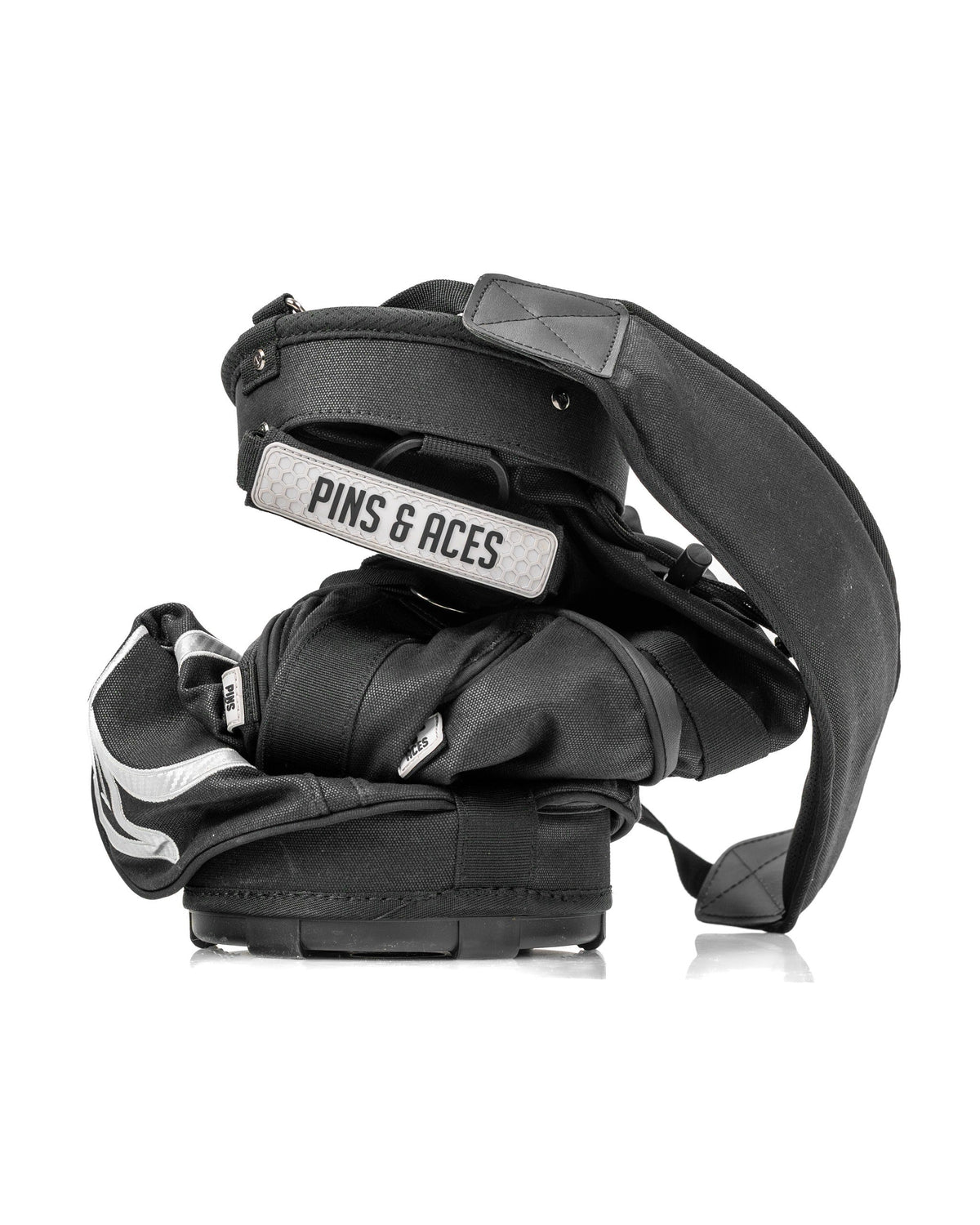 Compact Sunday golf bag in black with adjustable straps, designed for easy carrying on the course.
