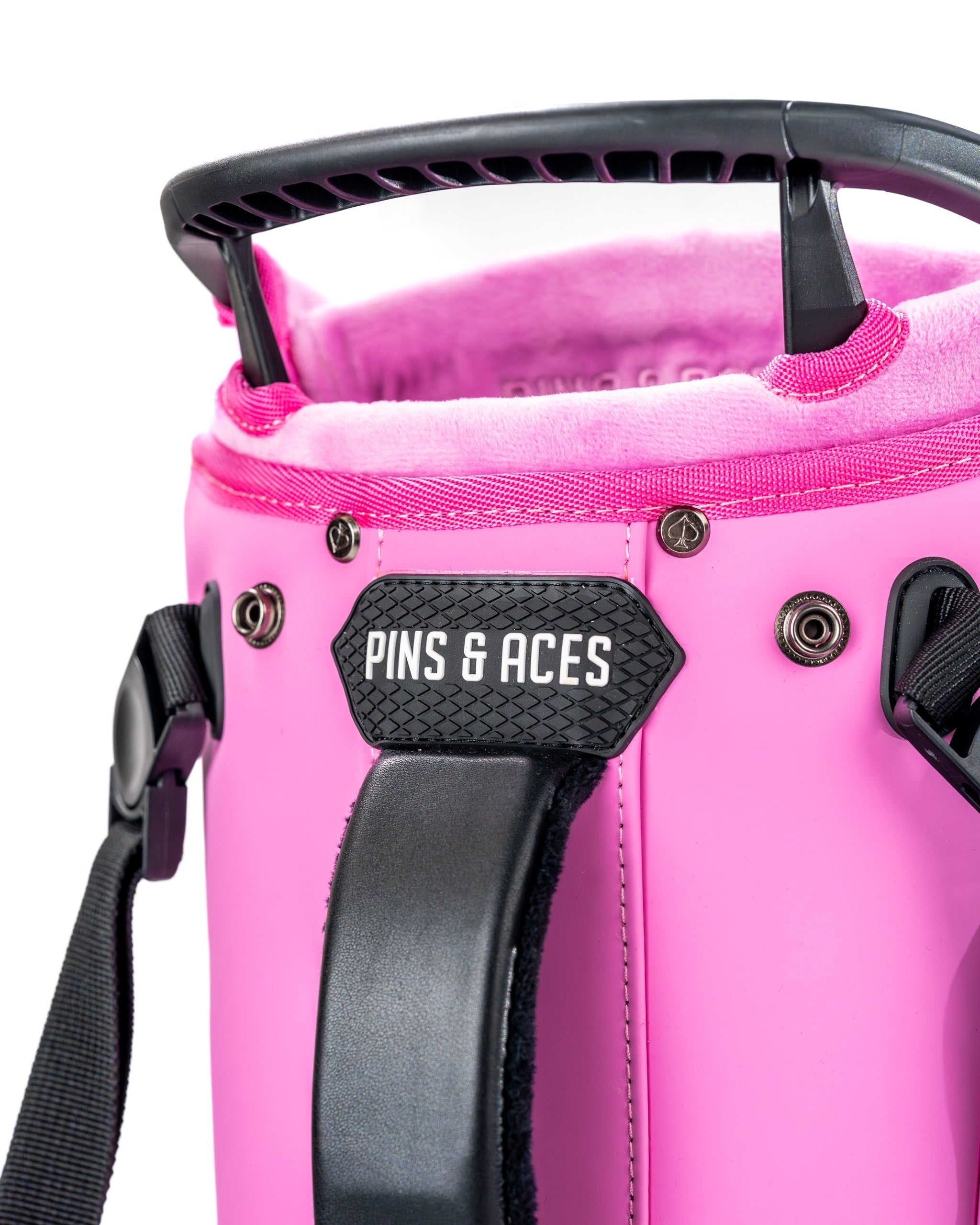 Close-up of the Player Preferred Golf Bag in Bubblegum 2.0, featuring a vibrant pink exterior and branded handle.