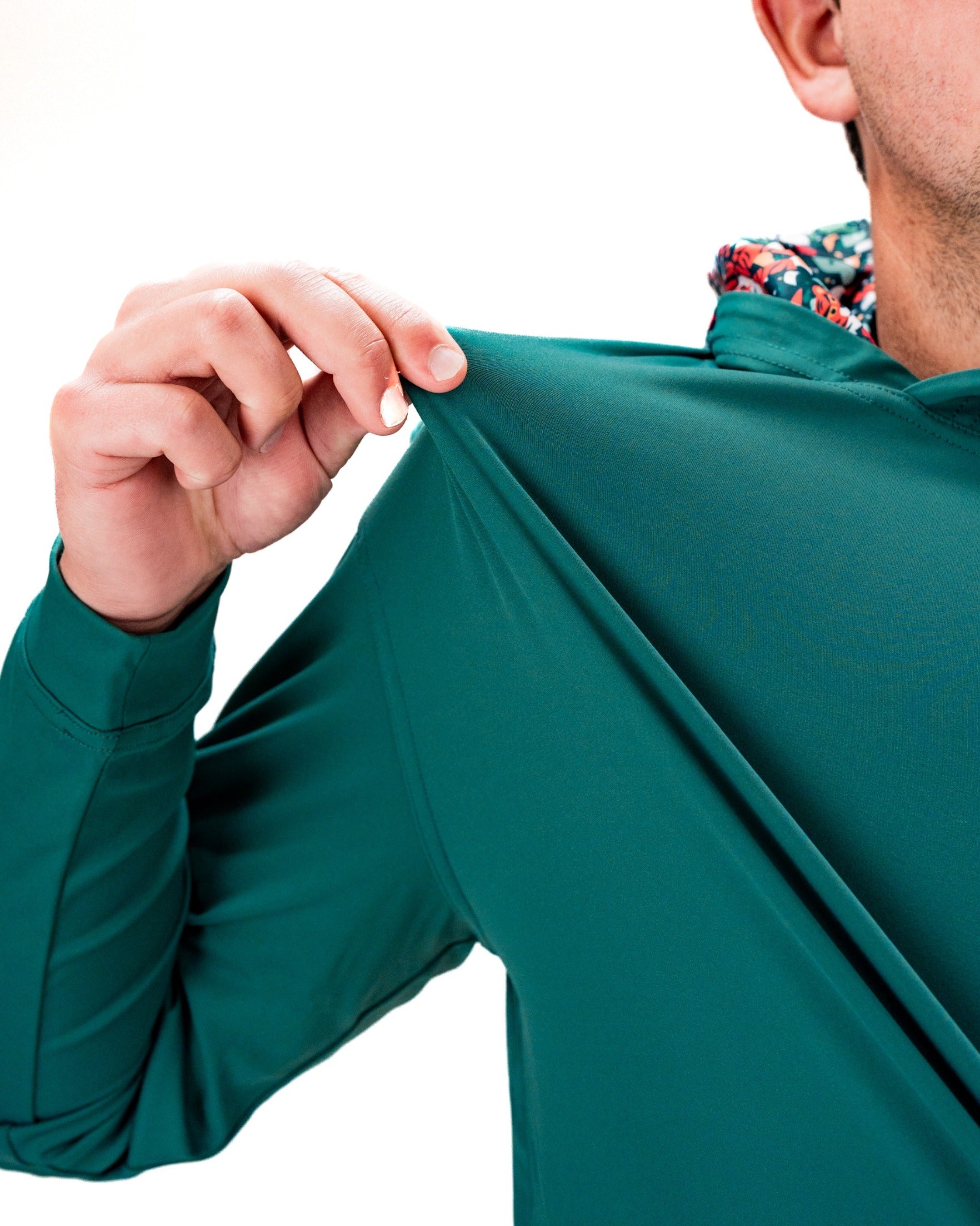 Performance Golf Hoodie in Tiger Shatter Teal, showcasing a close-up of the fabric and hood details for a stylish look.