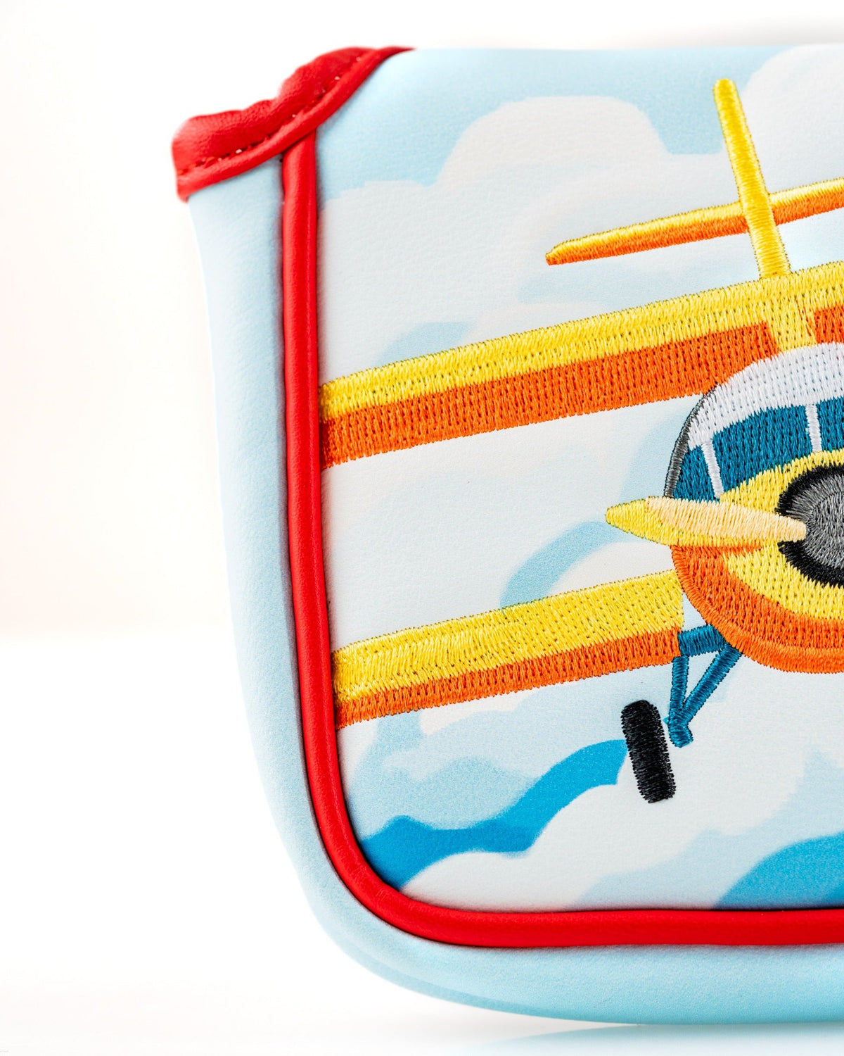 Colorful Margaritaville mallet putter cover featuring an embroidered airplane design against a blue sky background.
