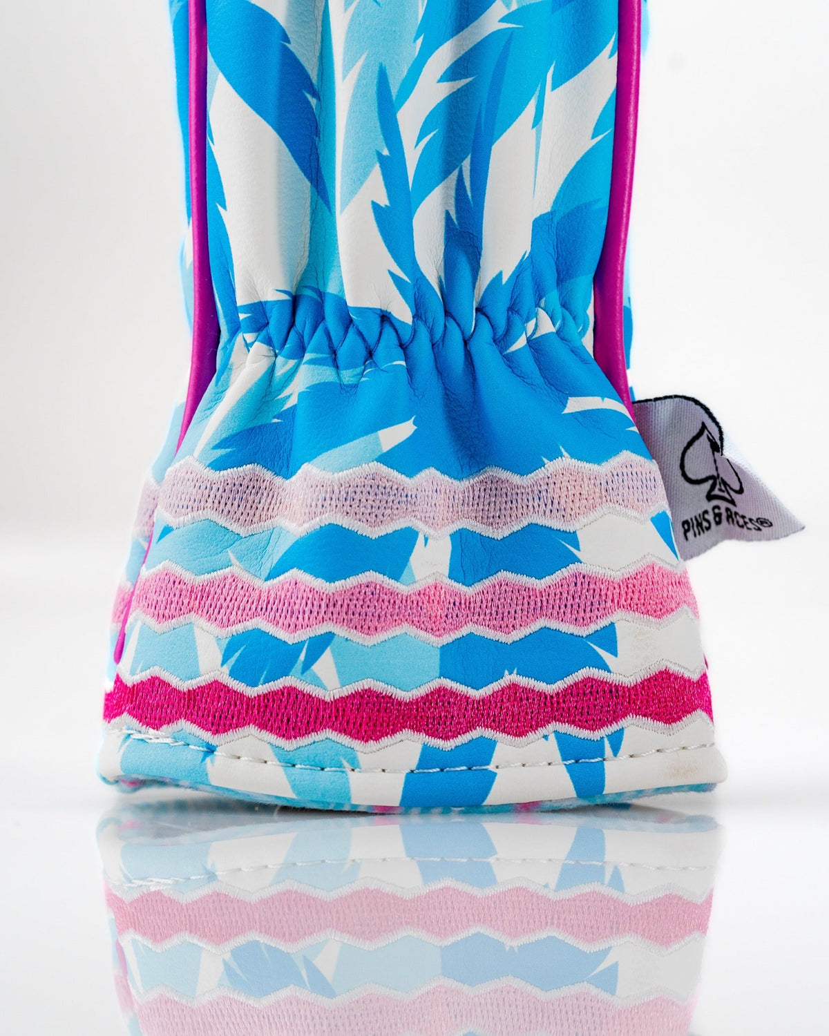 Colorful flamingo-patterned hybrid golf club cover with a snug fit and vibrant design, perfect for stylish golfers.