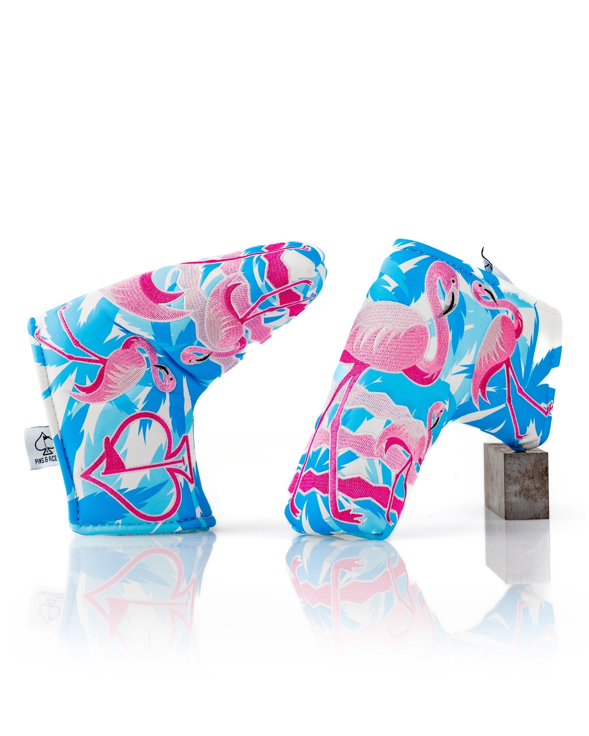 Vibrant flamingo-patterned blade putter cover featuring a colorful design, perfect for golfers seeking a bold accessory.