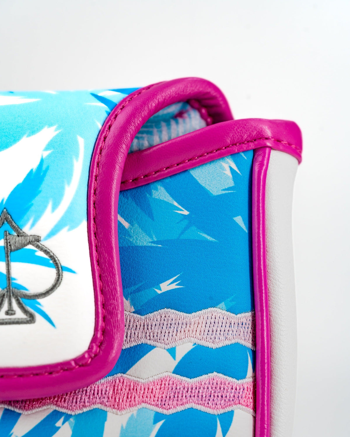 Vibrant flamingo-patterned mallet putter cover with pink trim, designed for golfers who want to stand out on the course.