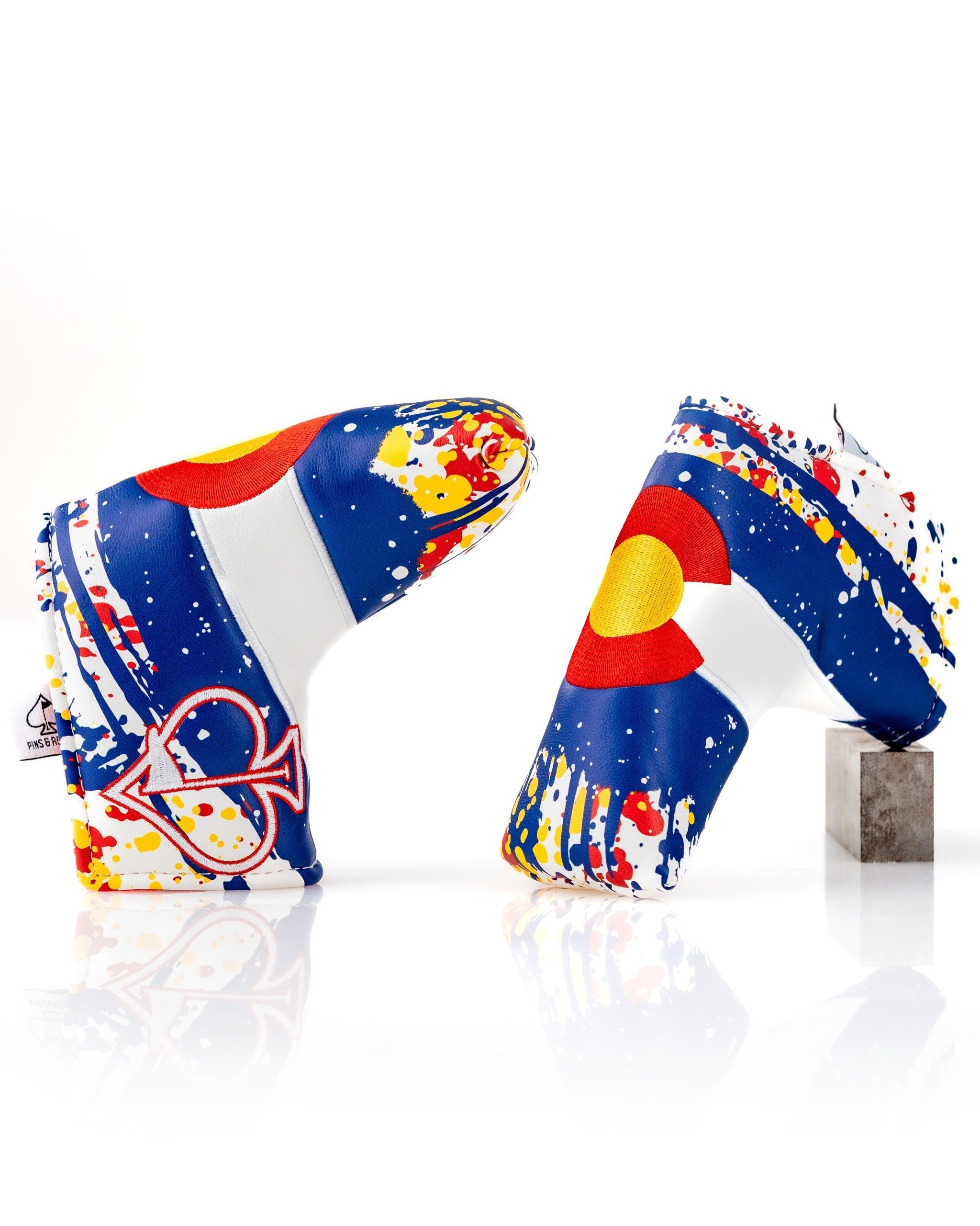 Bold Colorado 2.0 blade putter cover featuring a vibrant design with splashes of color and the Colorado state emblem.