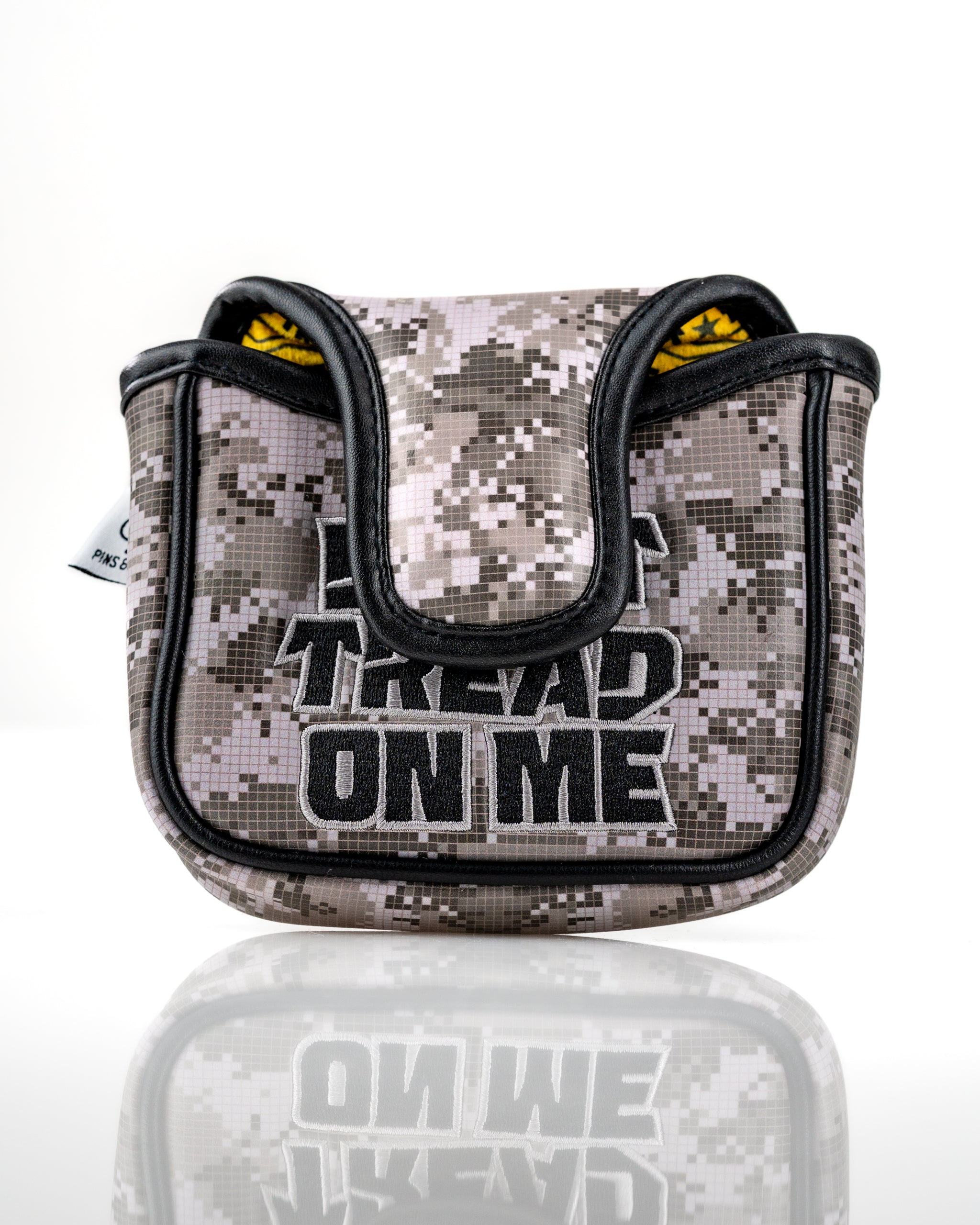Camouflage mallet putter cover featuring "Don't Tread On Me" text, designed for golfers seeking bold accessories.