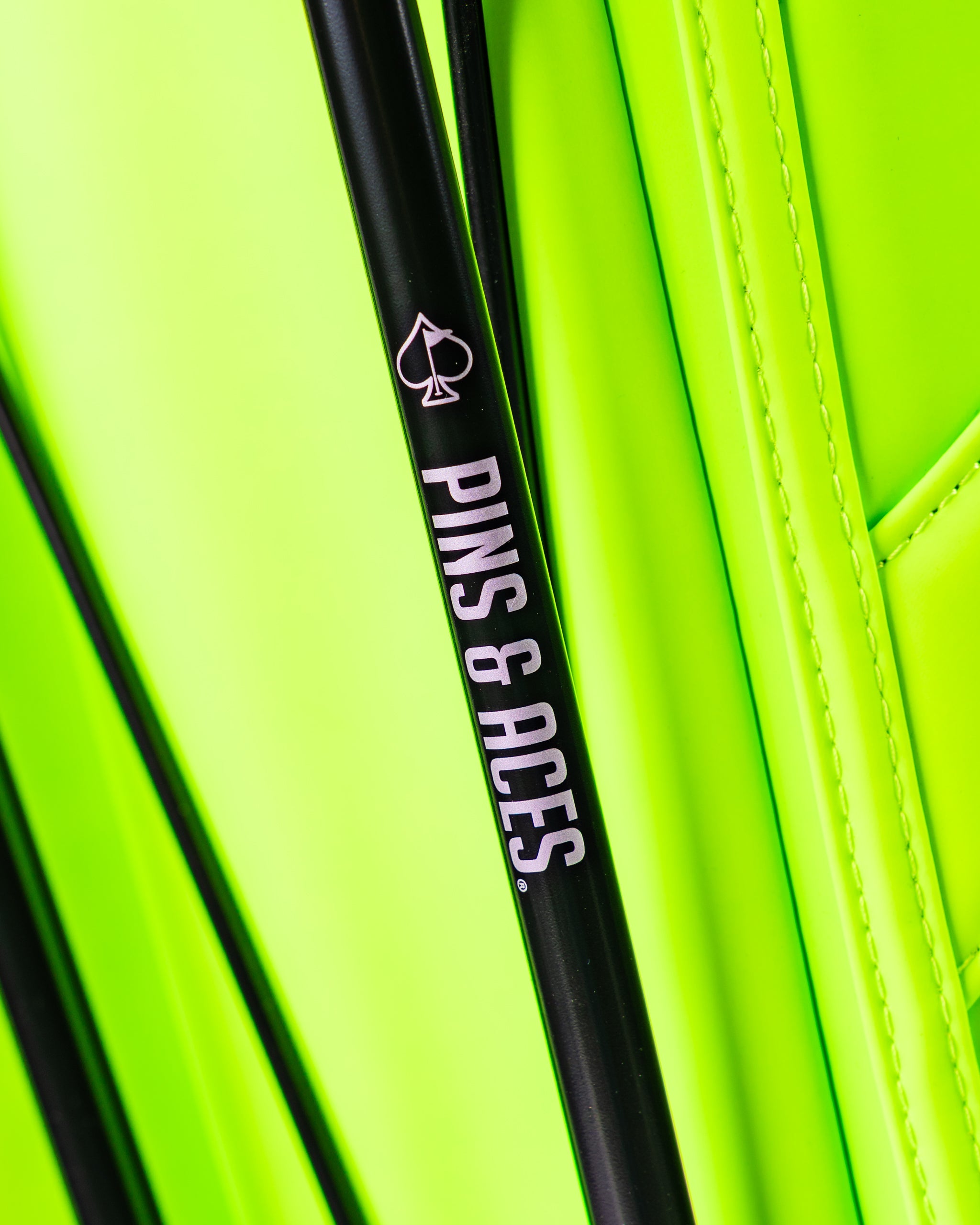 Bright electric tide golf bag featuring the Pins & Aces logo, designed for stylish and bold golfers.