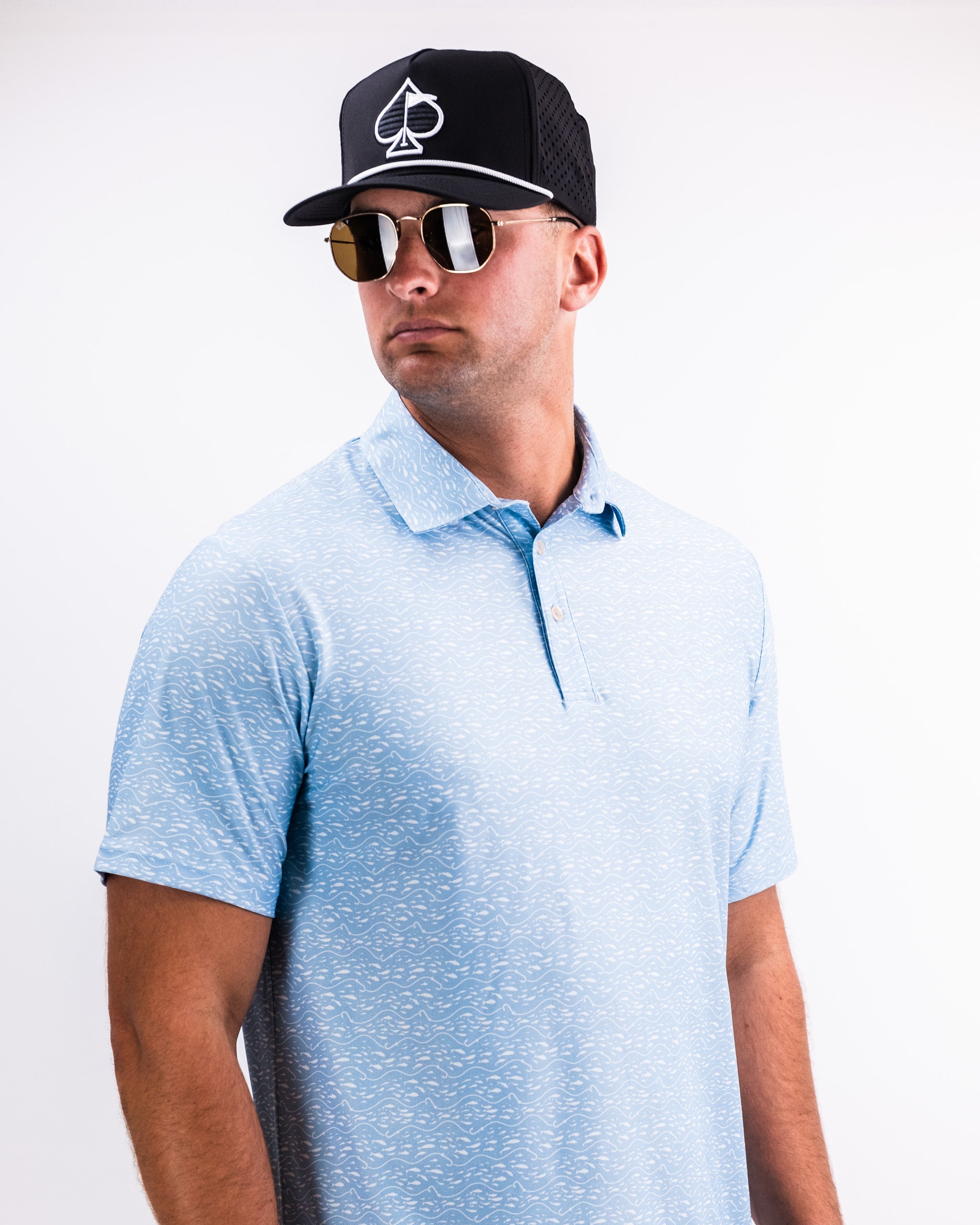 Alt text: Player Preferred™ Polo in Tidal Flow, showcasing a light blue color with a sleek design, featuring a collar and short sleeves, displayed against a neutral background.