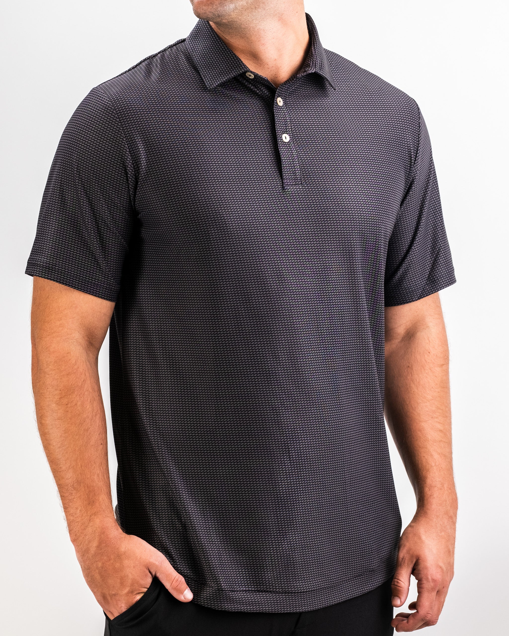 Player Preferred™ Polo in Night Wave color, featuring a comfortable fit and modern design, displayed on a wooden surface with natural lighting.