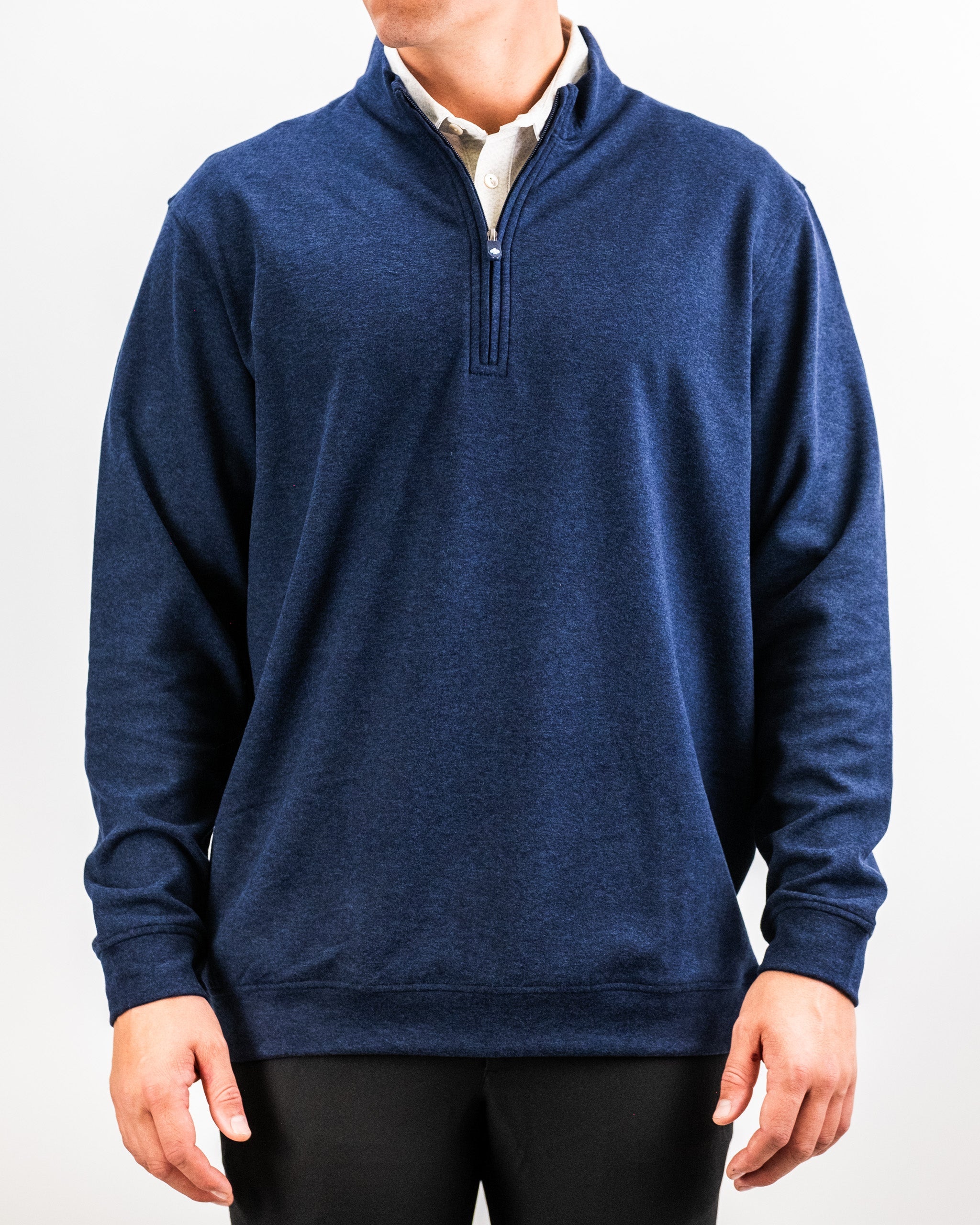 Men's Heathered Navy Player Preferred™ Pullover with a quarter-zip collar, worn over a white shirt, casual and comfortable.