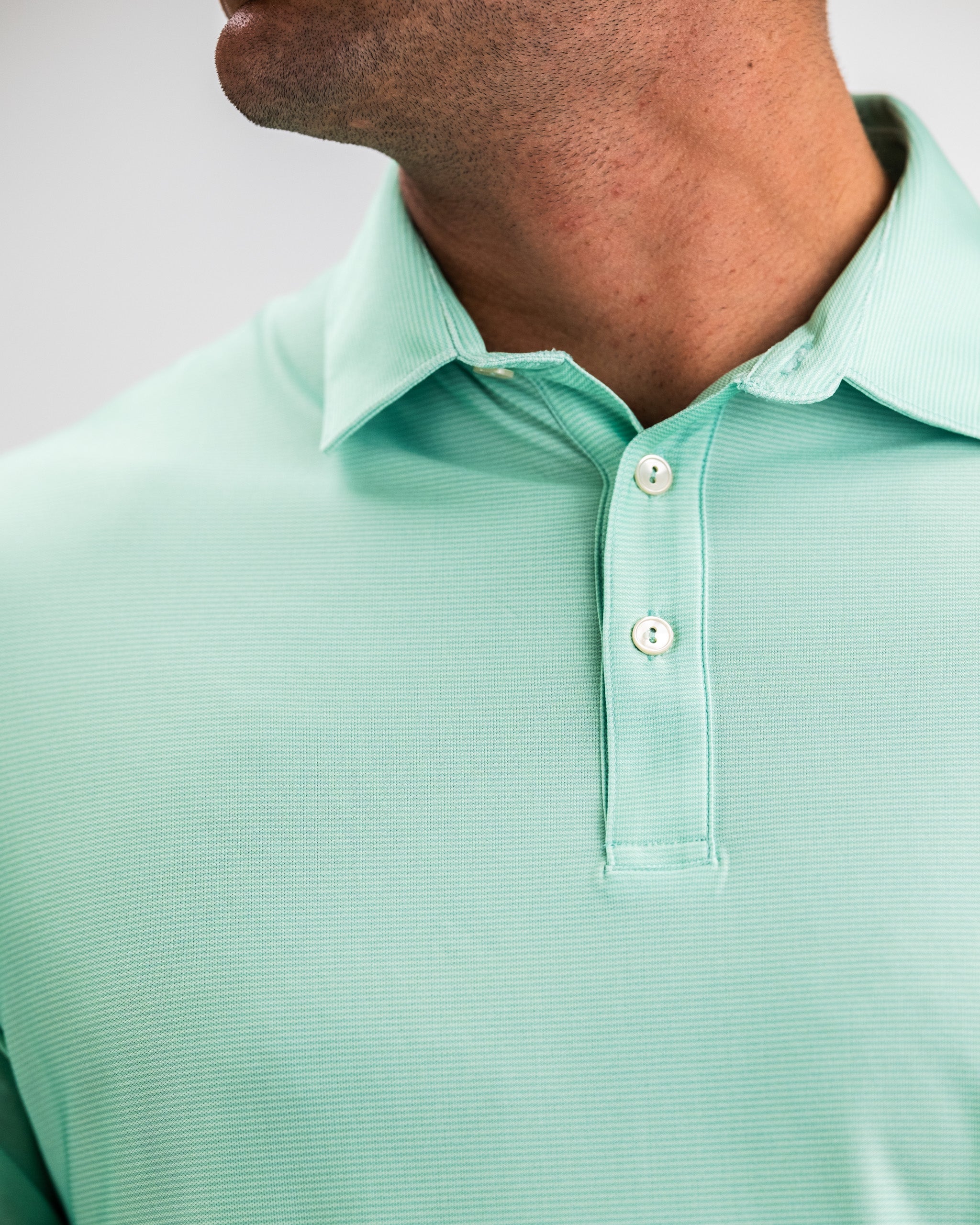 Player Preferred™ Polo in Spearmint Stripes, featuring a modern design with a breathable fabric and stylish striped pattern.