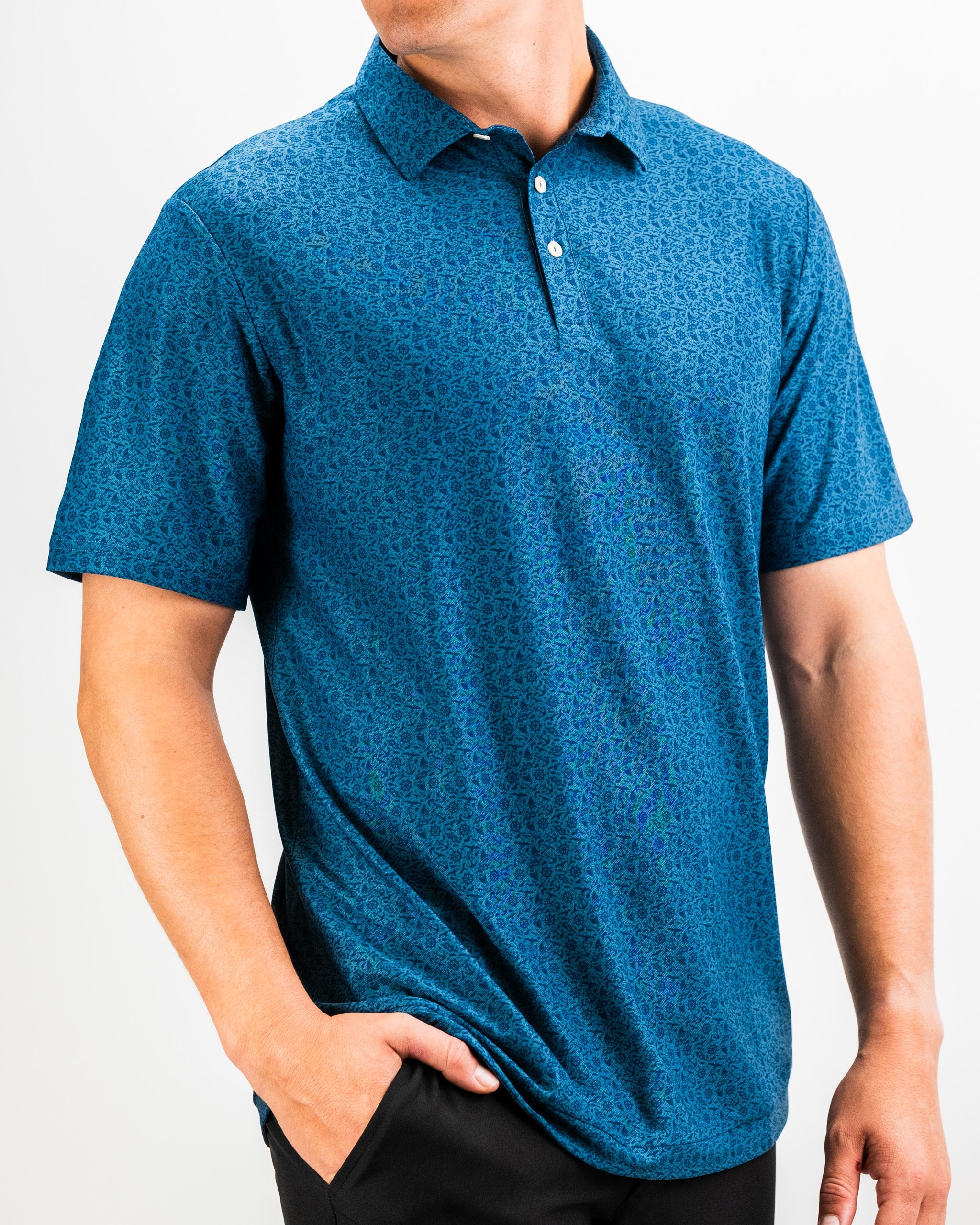 "Player Preferred™ Polo - The Mariner, featuring a navy blue design with a classic collar and short sleeves."