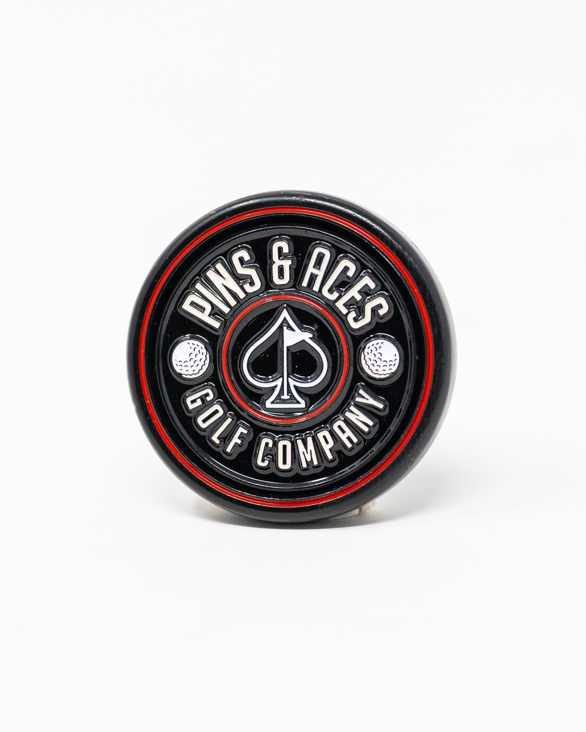 Black Pop Out Medallion Ball Marker, showcasing a sleek design and compact size for easy use on the golf course.