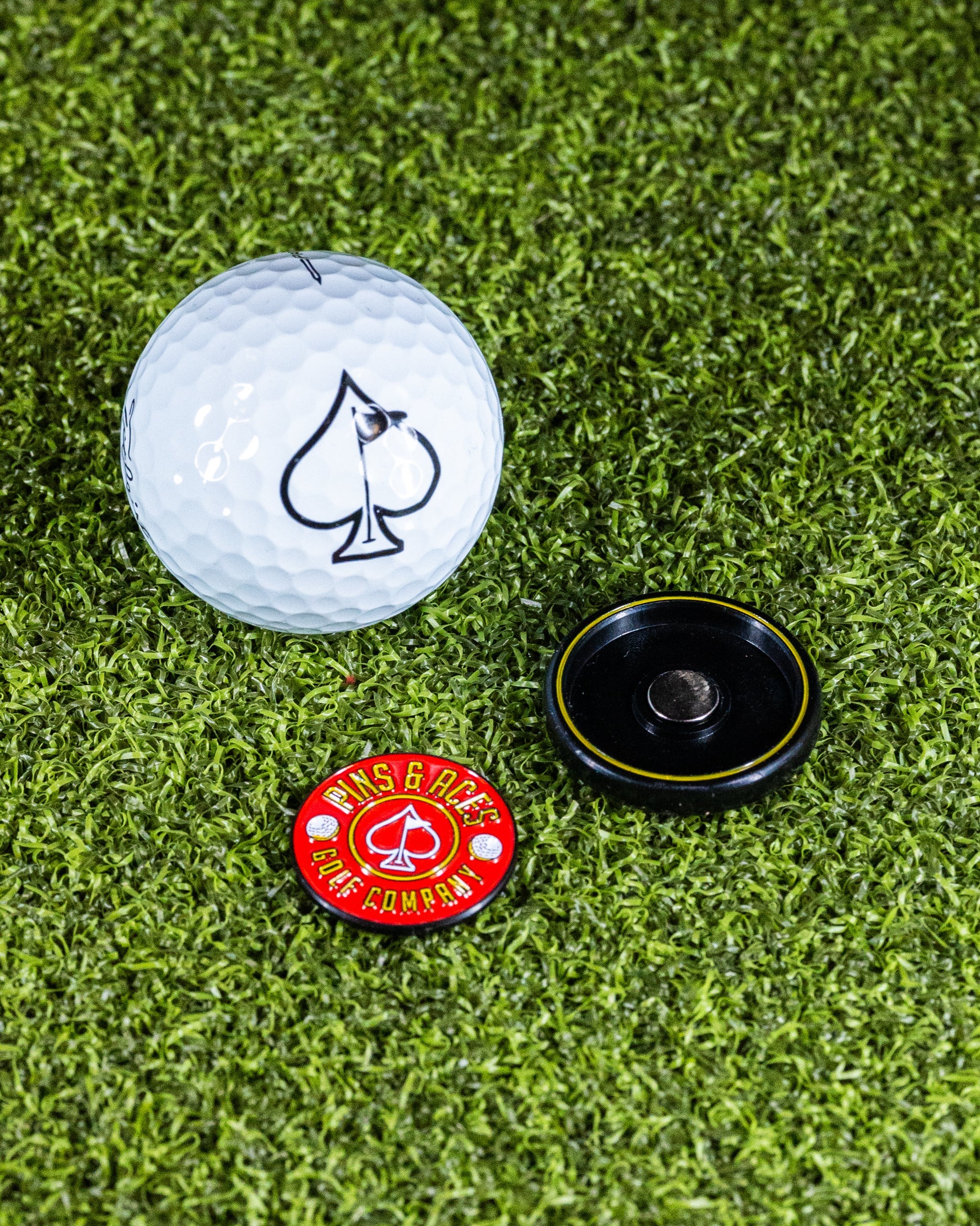 Red Pop Out Medallion Ball Marker with a sleek design, ideal for golf enthusiasts.