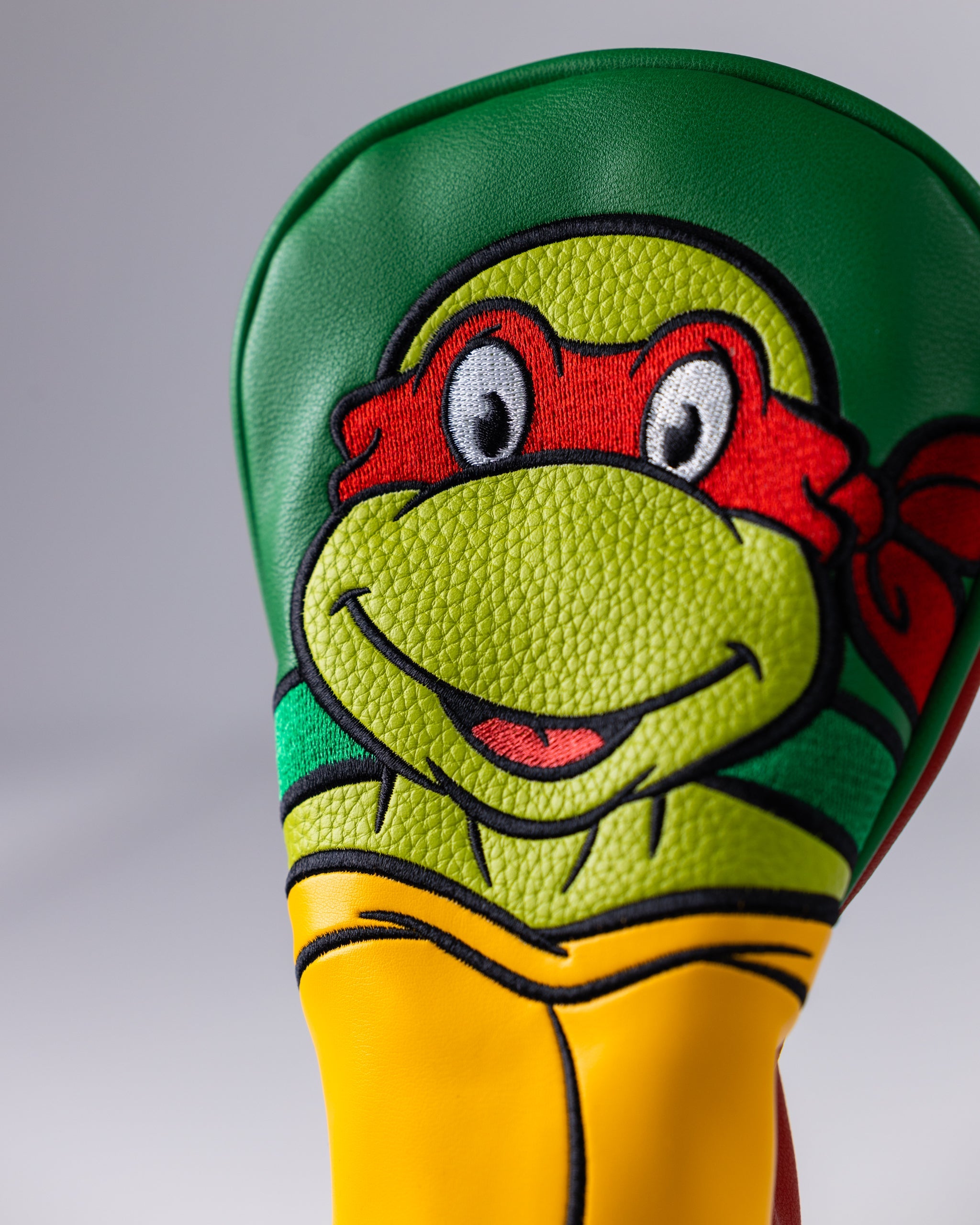 TMNT Raphael Fairway Cover featuring a vibrant green design with Raphael's signature red mask, designed to protect golf clubs.