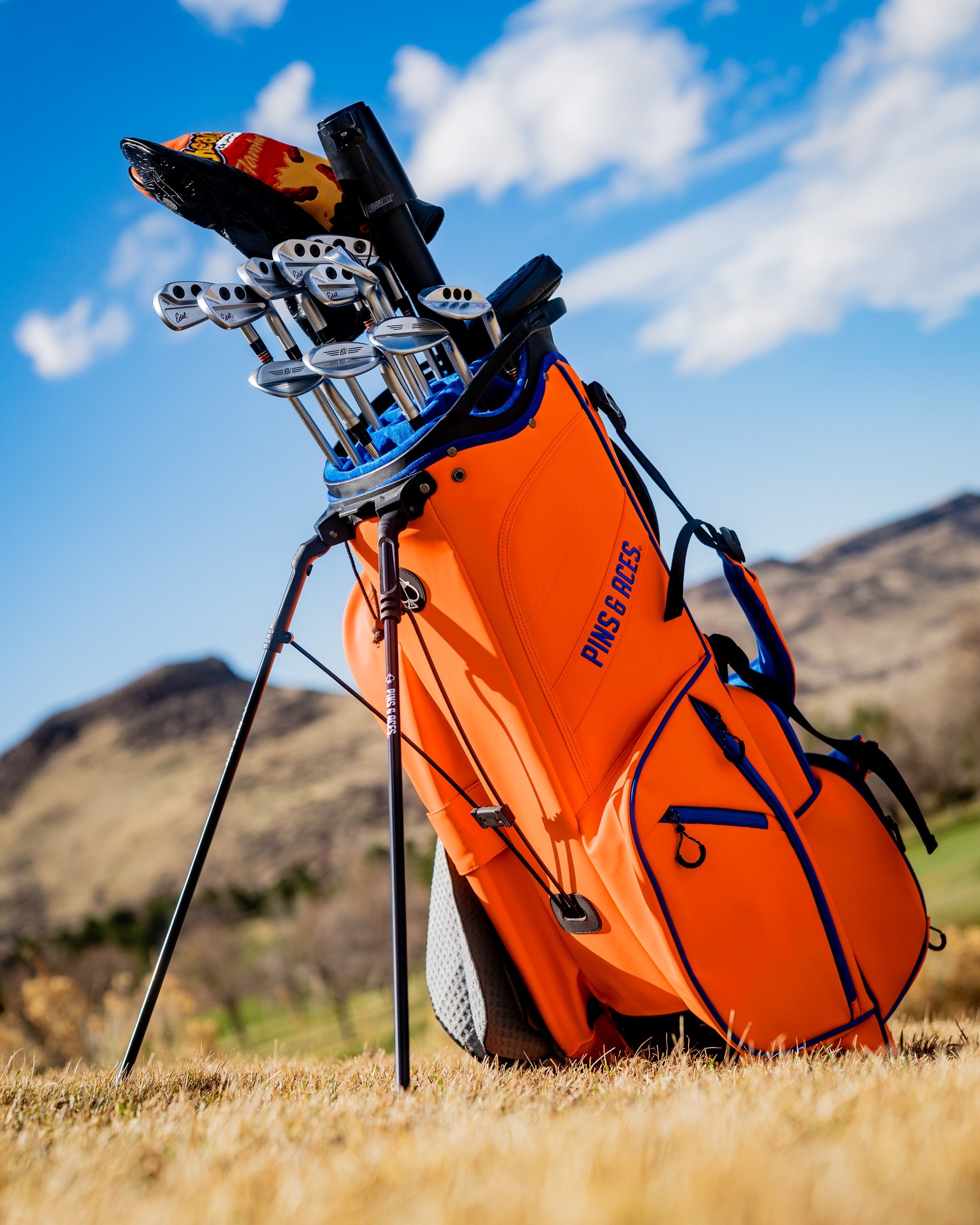 Player Preferred™ Golf Bag in Orange Crush color with ergonomic design and multiple pockets for golf accessories.