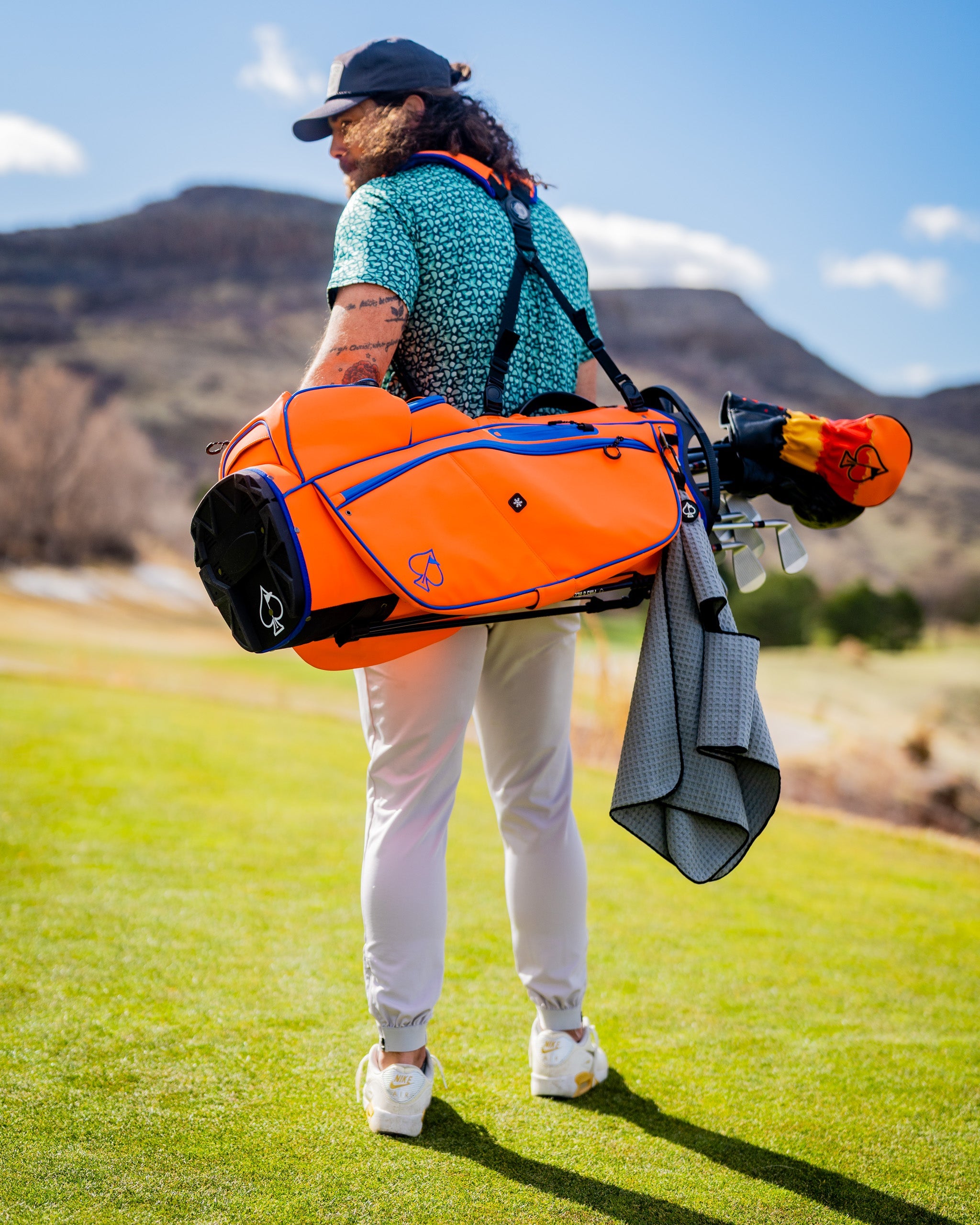 Player Preferred™ Golf Bag in Orange Crush, featuring a sleek design and spacious compartments for golf clubs and accessories.