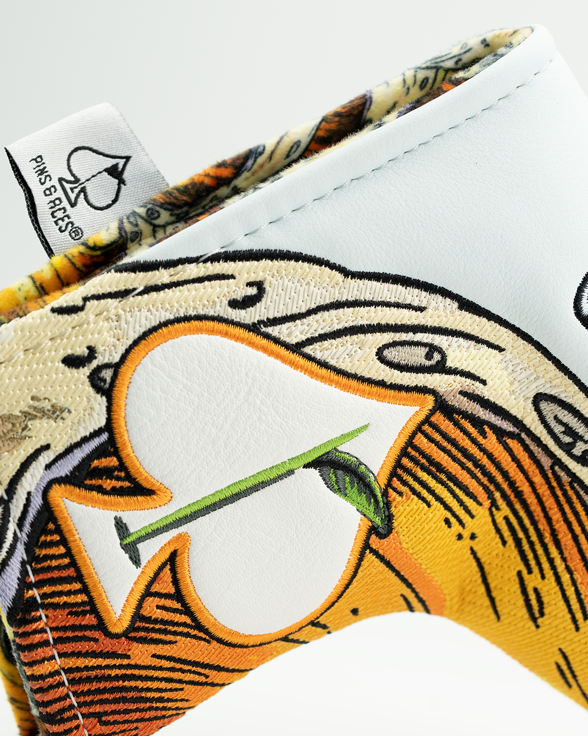 Bold blade putter cover featuring a vibrant design with an ace of spades motif, perfect for stylish golfers.