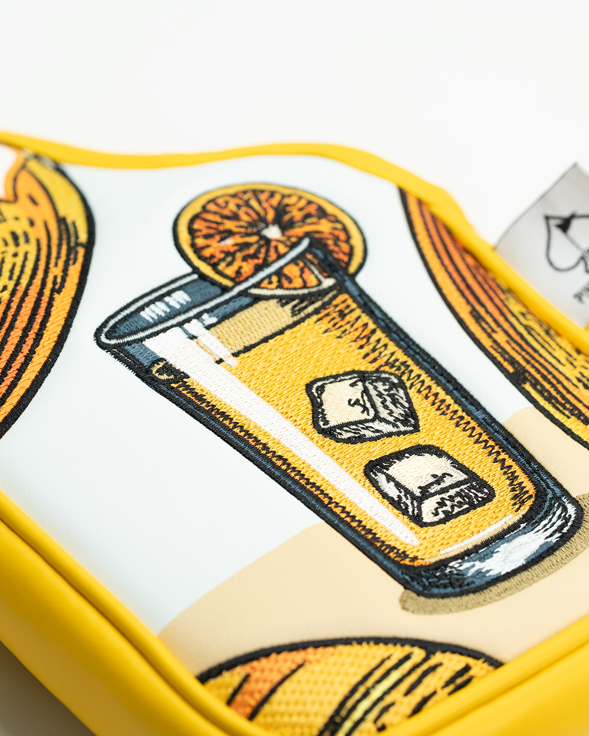 Vibrant mallet putter cover featuring an embroidered design of a refreshing drink with ice and an orange slice.