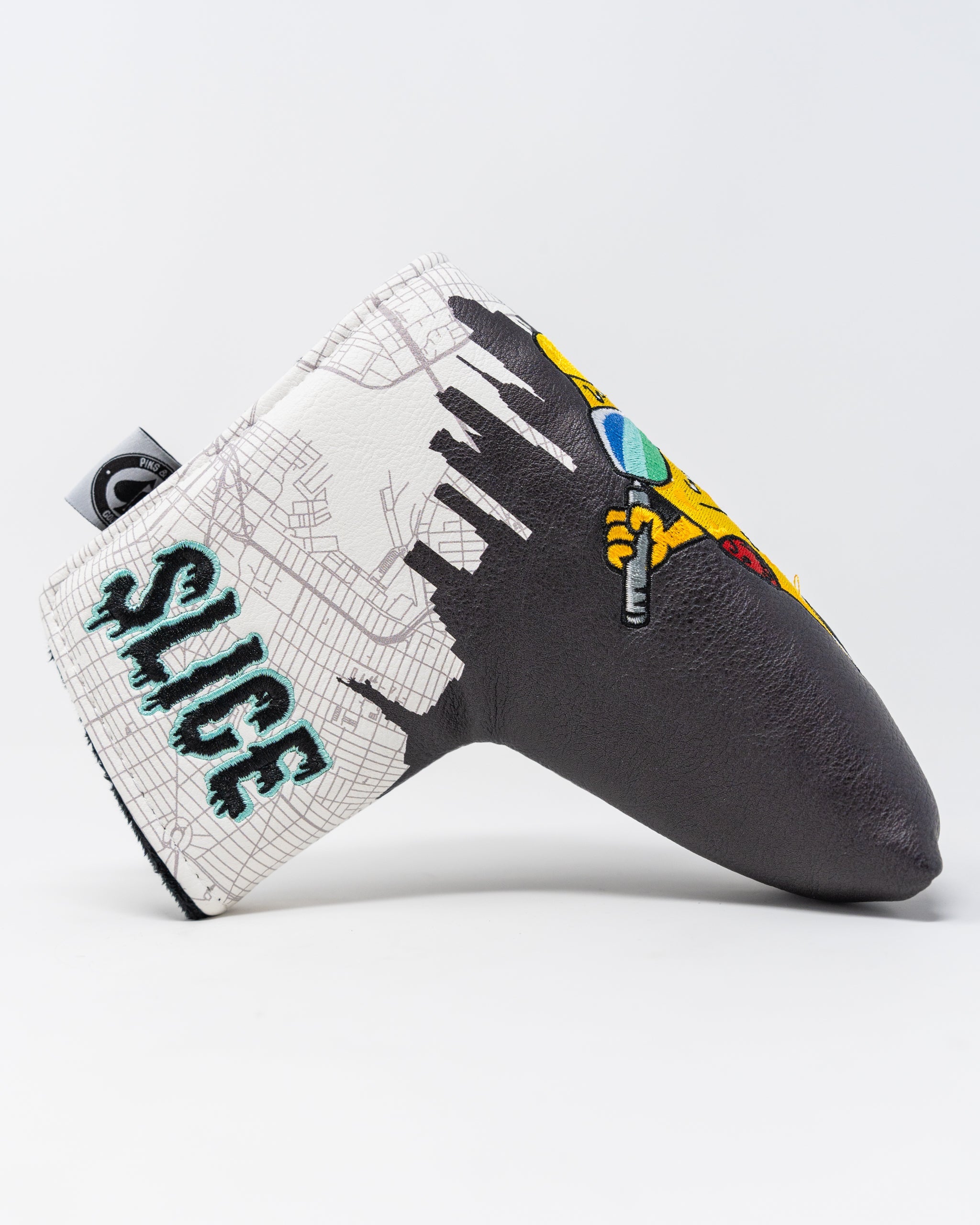 Shady Slice Blade Putter Cover in dark green with a stylish design and logo.