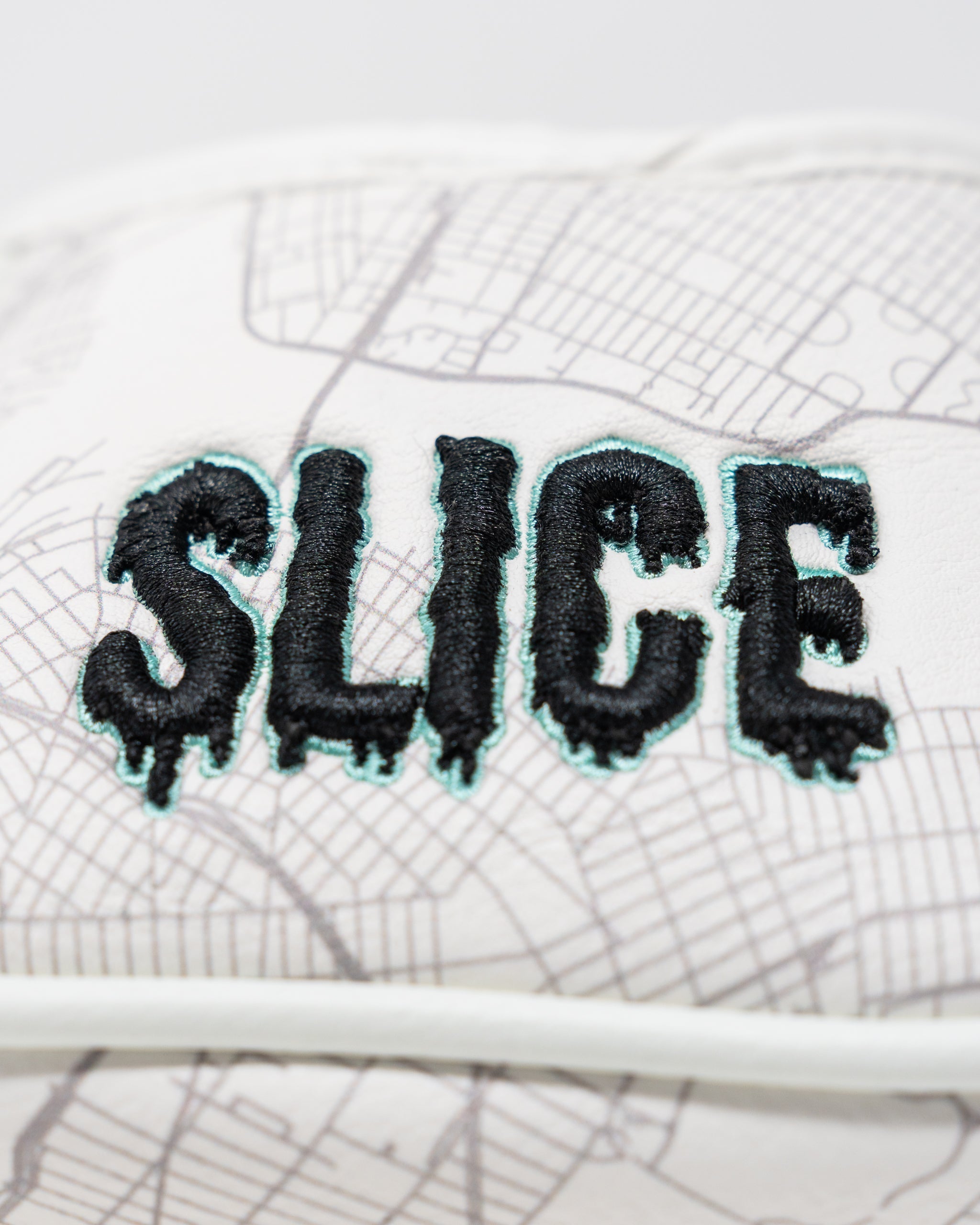 Shady Slice mallet cover featuring a vibrant design with tropical palm leaves and a secure elastic band for protection.