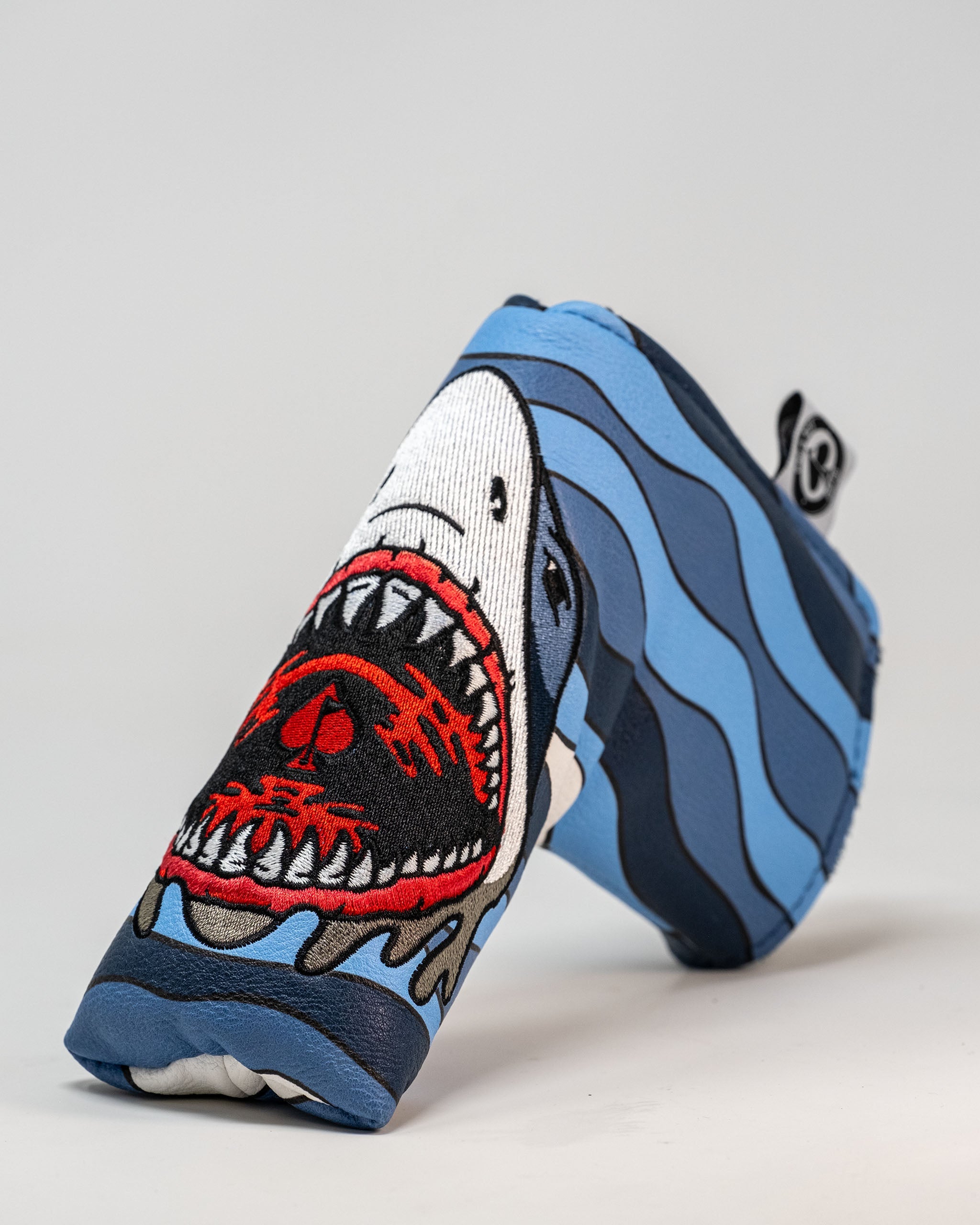 Shark Attack Blade Putter Cover featuring a vibrant shark design and protective fit for standard blade putters.