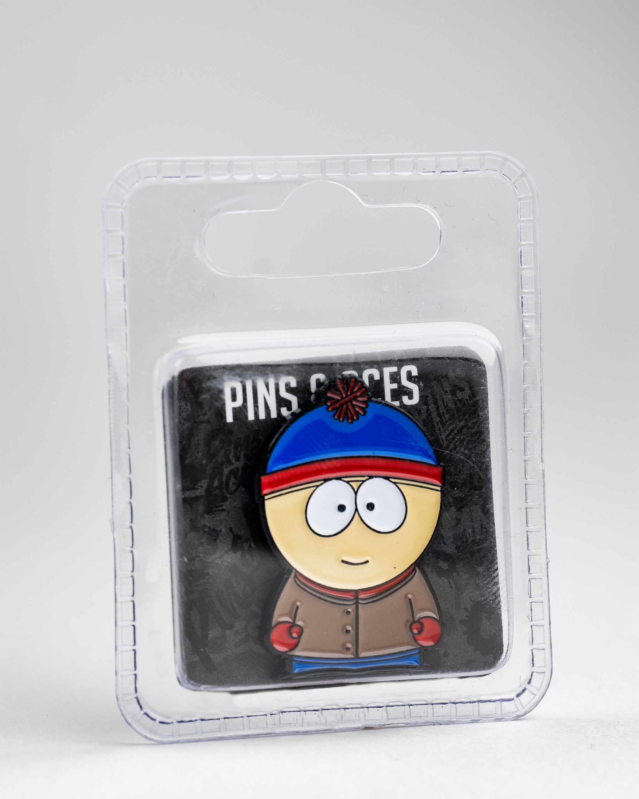 South Park Stan ball marker featuring the character in his signature blue hat and red jacket, designed for golf enthusiasts.