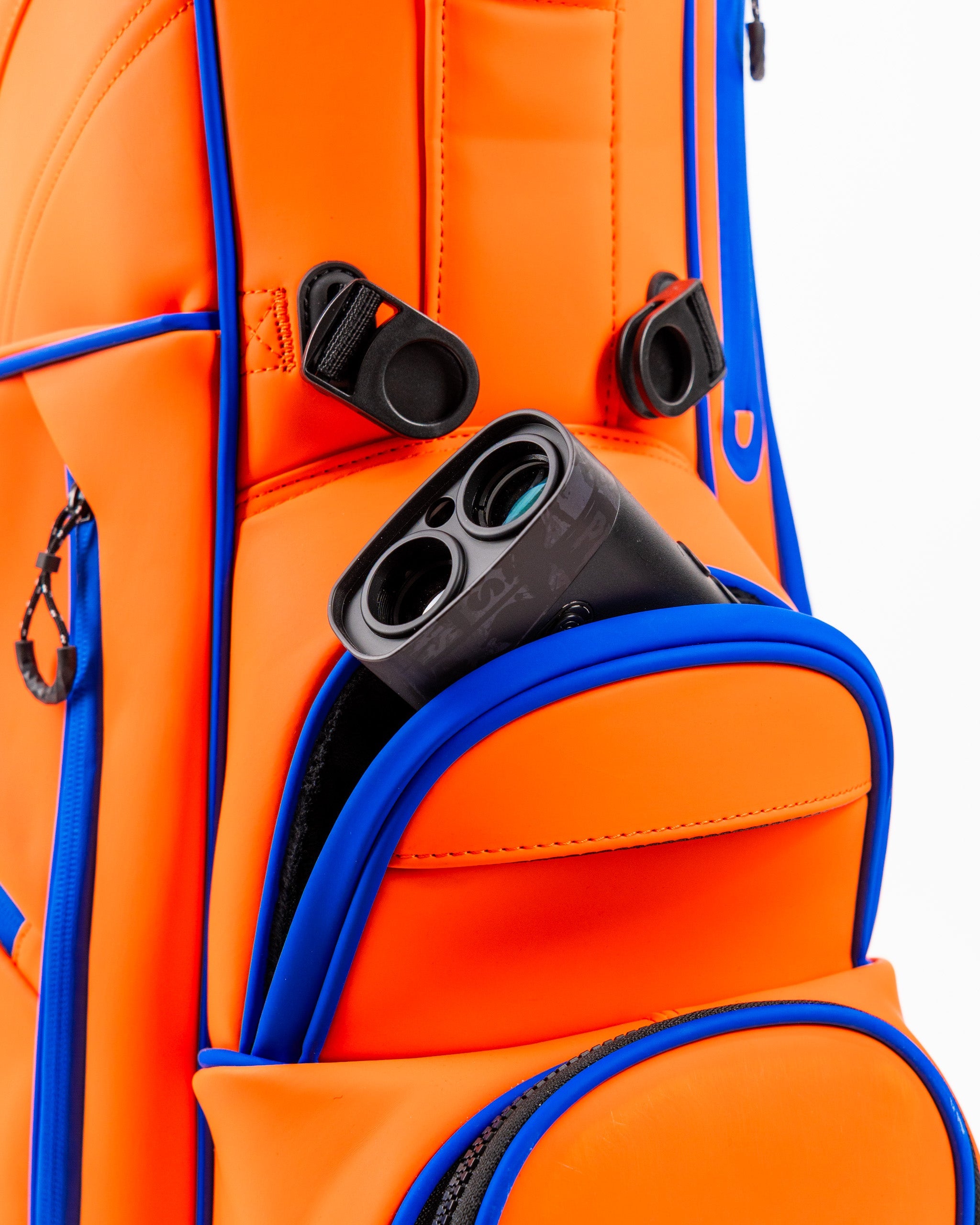Alt text: Player Preferred™ Golf Bag in vibrant orange with multiple pockets and a comfortable strap.