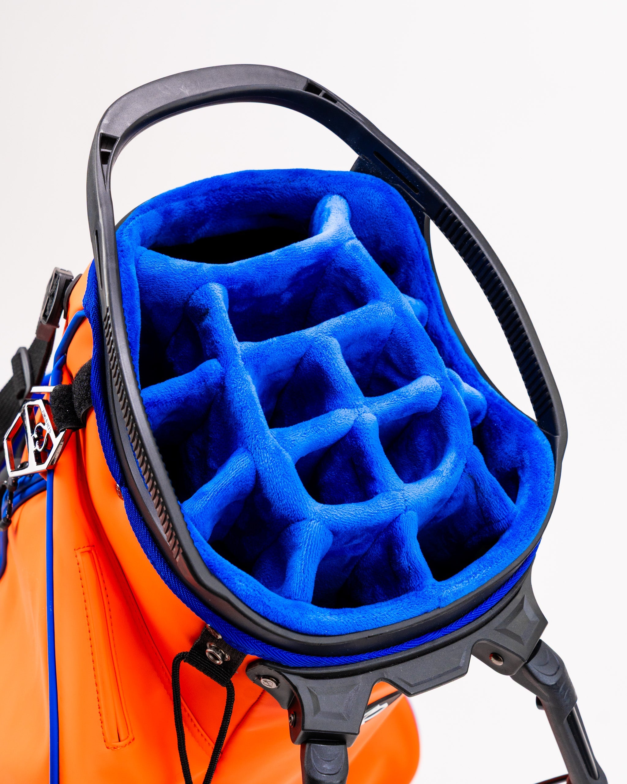 Player Preferred™ Golf Bag in Orange Crush, featuring a sleek design with multiple compartments, padded shoulder straps, and a durable exterior.