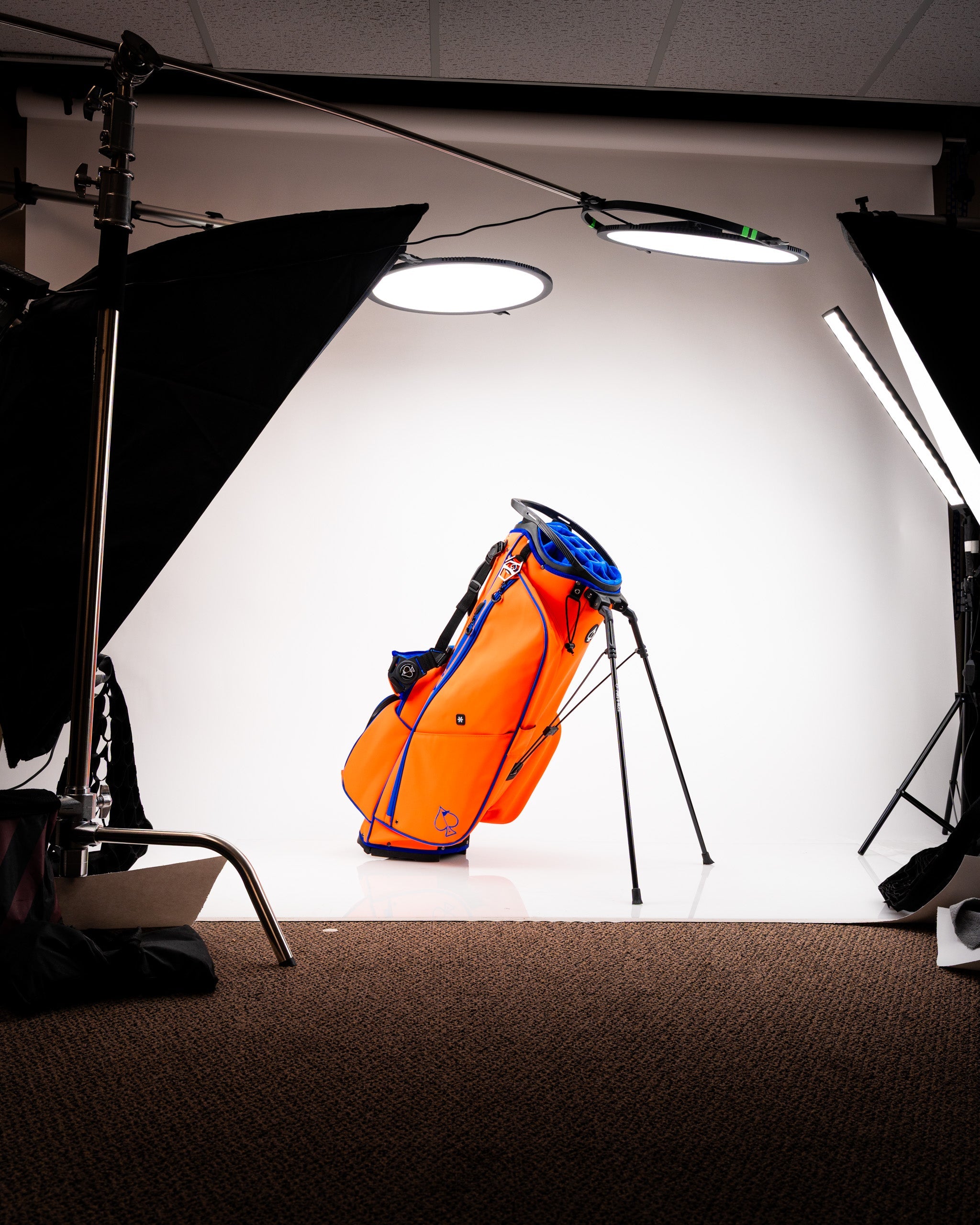 Player Preferred™ Golf Bag in Orange Crush color, featuring multiple pockets and a sleek design.