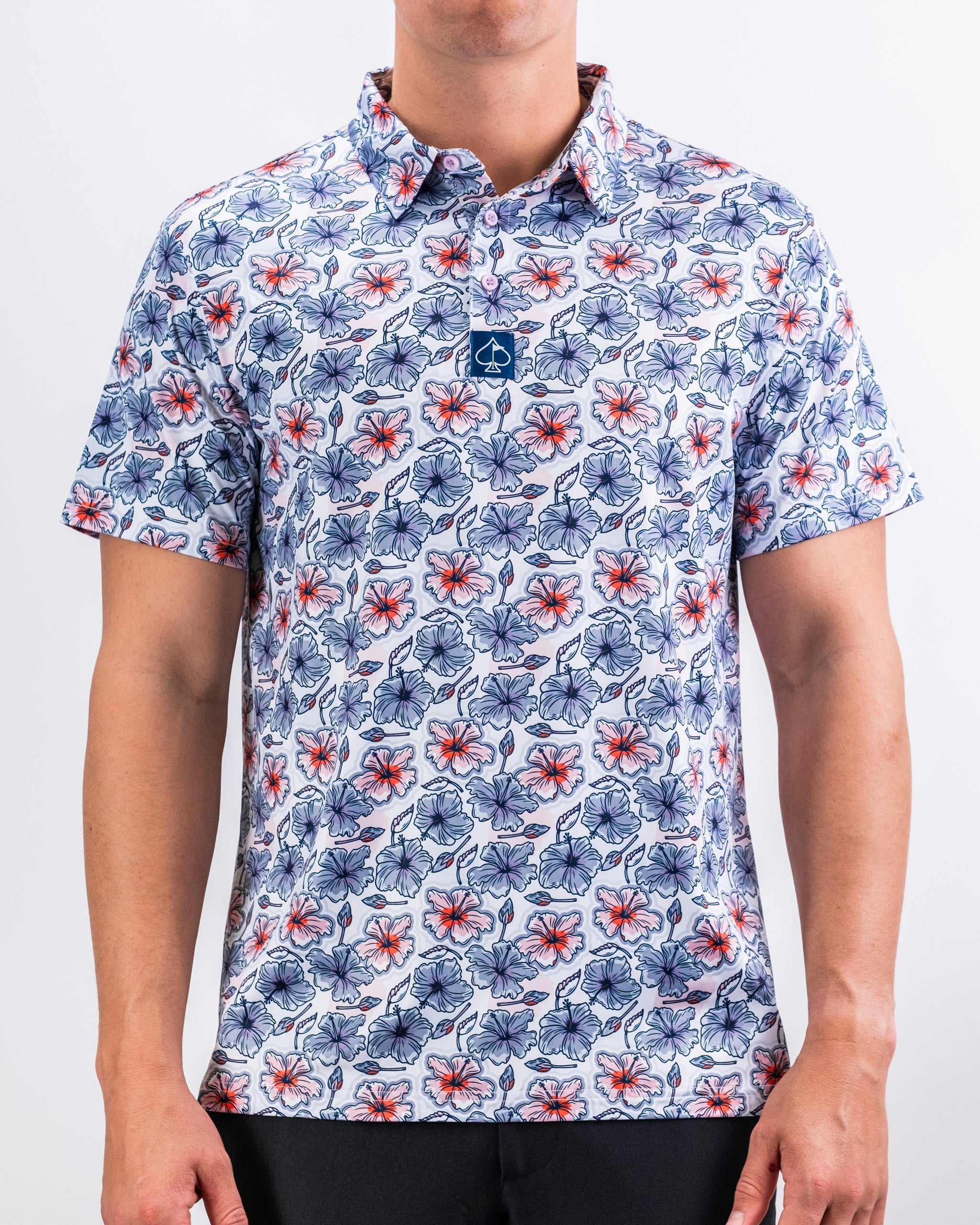 Men's Hibiscus Harmony shirt featuring vibrant hibiscus floral pattern on a light background, perfect for spring and summer wear.