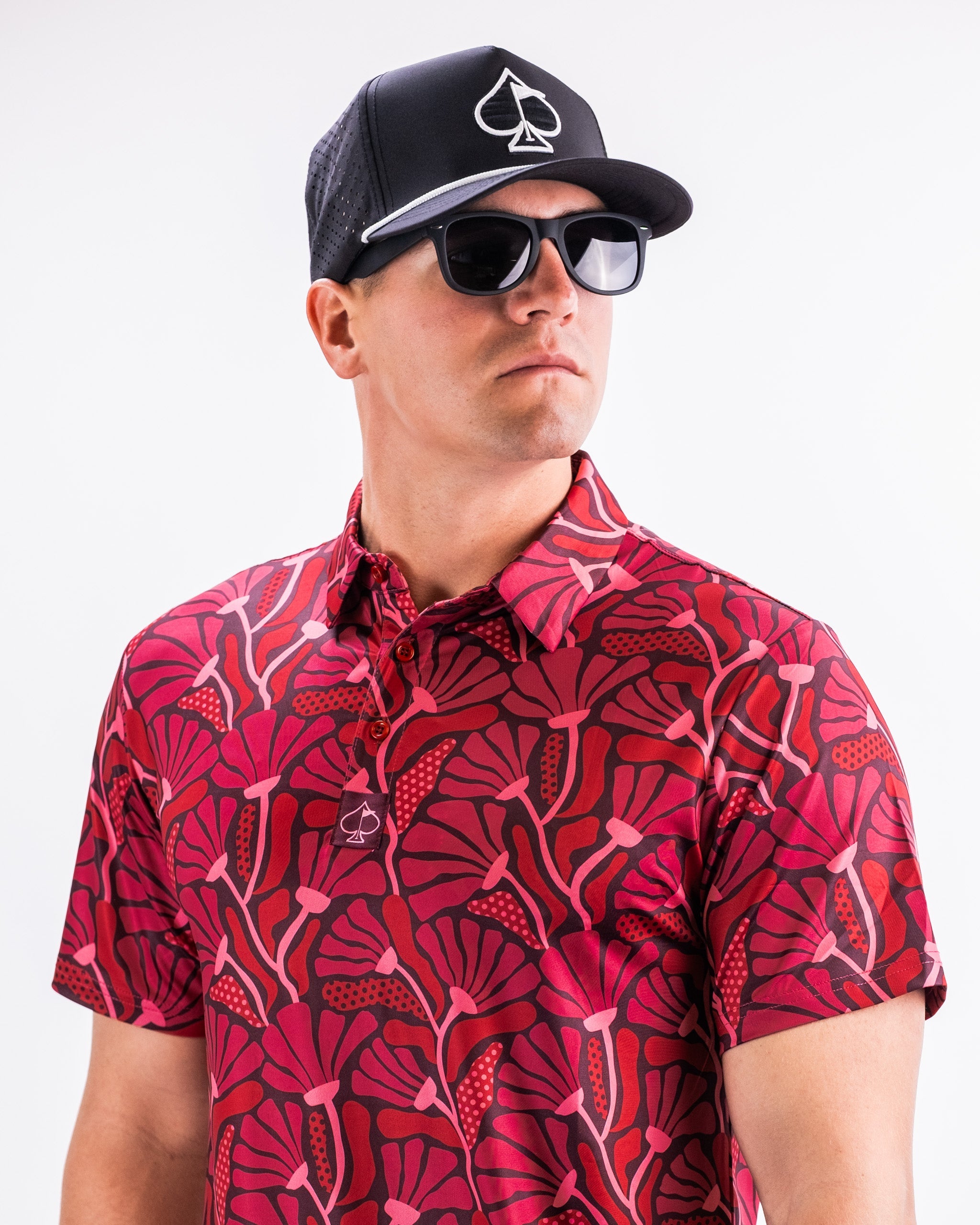 Men's garden party shirt featuring a vibrant crimson floral pattern against a dark background.