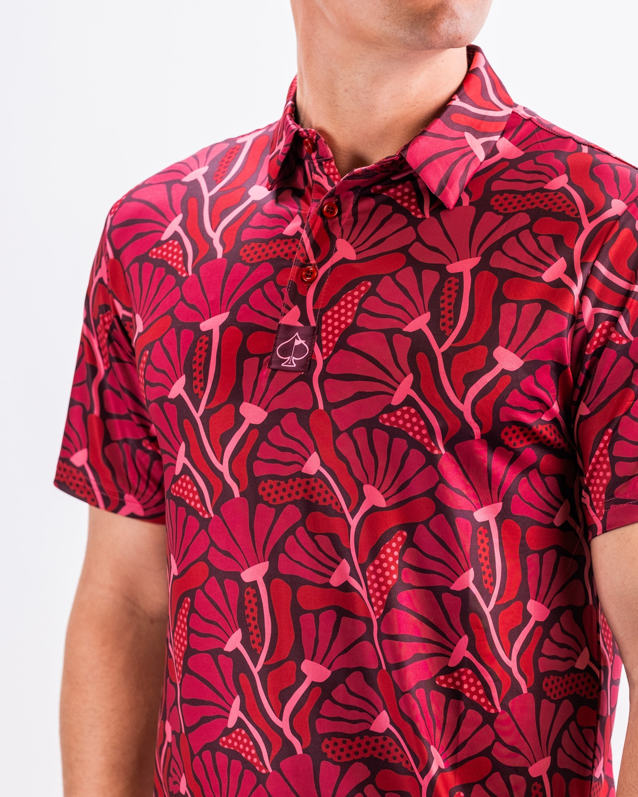 Garden Party Crimson Bloom men's shirt featuring a vibrant floral pattern in shades of red and green.