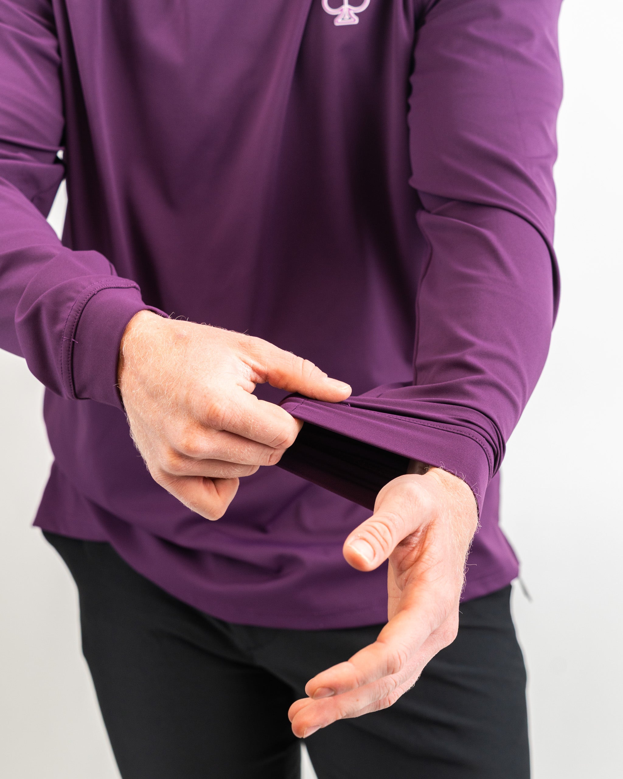 Performance Golf Hoodie in Houndstooth Raspberry pattern. Stylish and functional design features a hood, long sleeves, and a comfortable fit, ideal for golfing or casual wear.