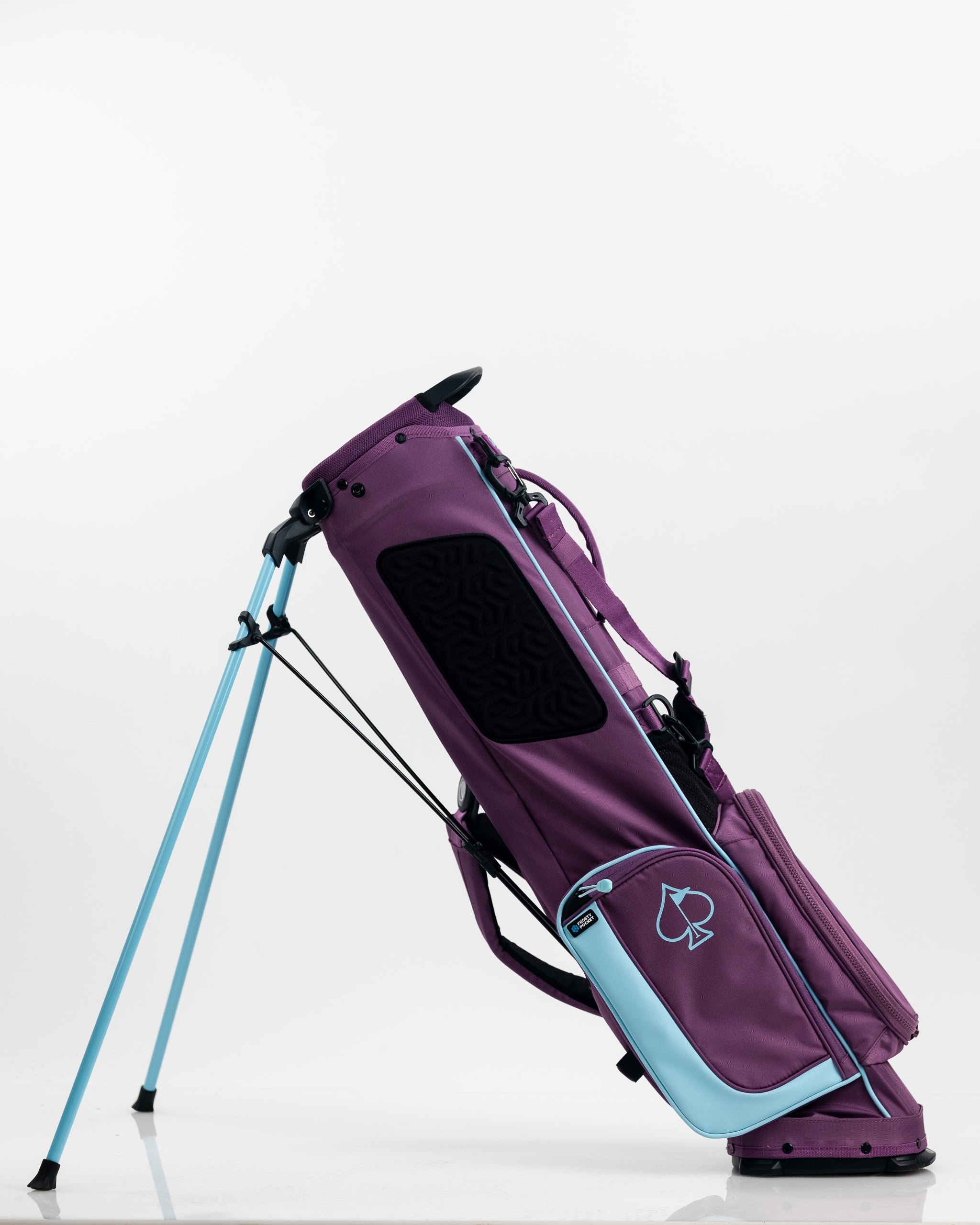Purple golf stand bag with black and light blue accents, featuring a bold spade logo and multiple storage compartments.
