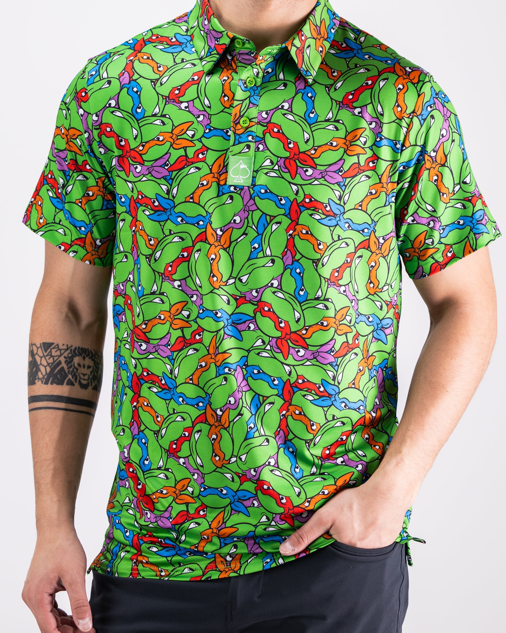 TMNT Mean Green Polo featuring turtle head graphics and vibrant green color.