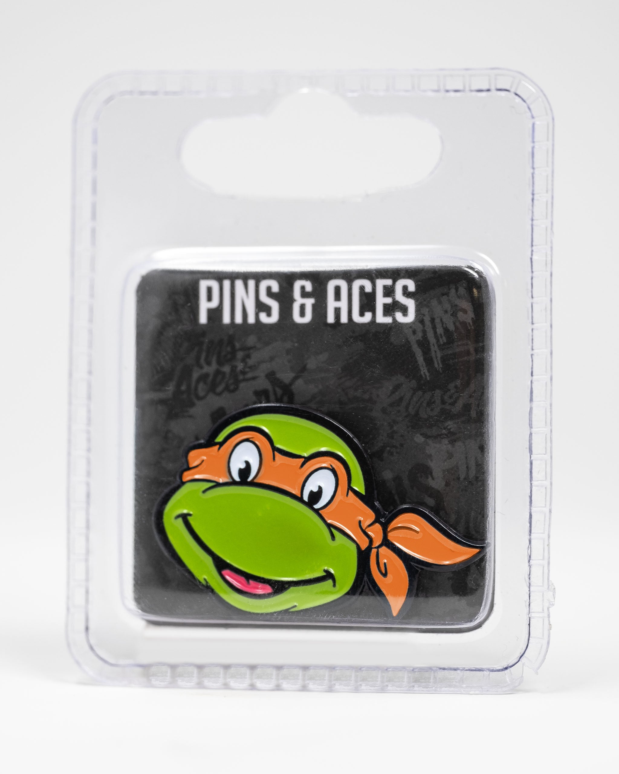 TMNT Michelangelo ball marker featuring a vibrant orange and green design with the character's face.