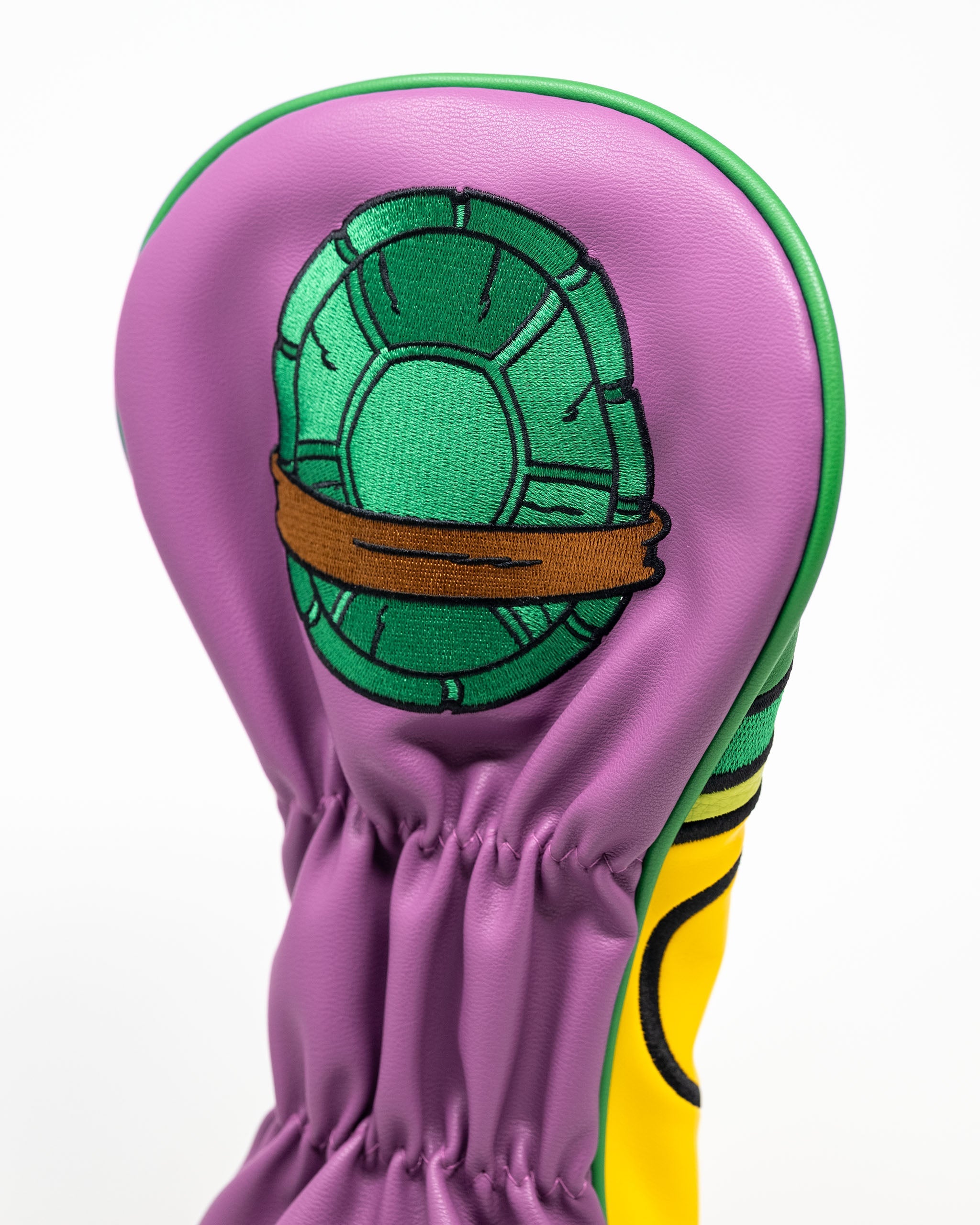 TMNT Donatello driver cover featuring a vibrant design of the character's face and purple bandana.