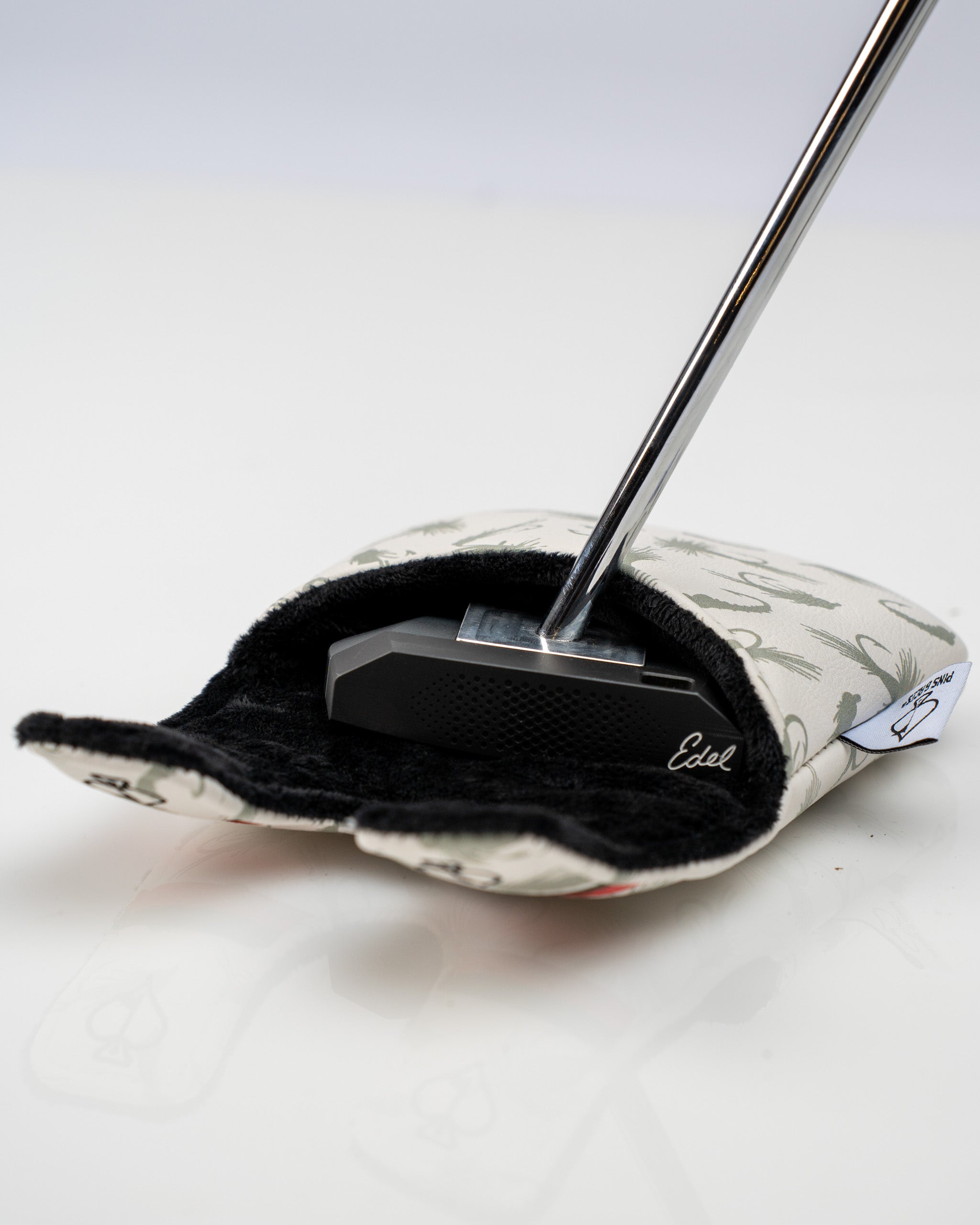 Trout center shaft mallet putter cover featuring a soft interior and stylish exterior design for golf enthusiasts.